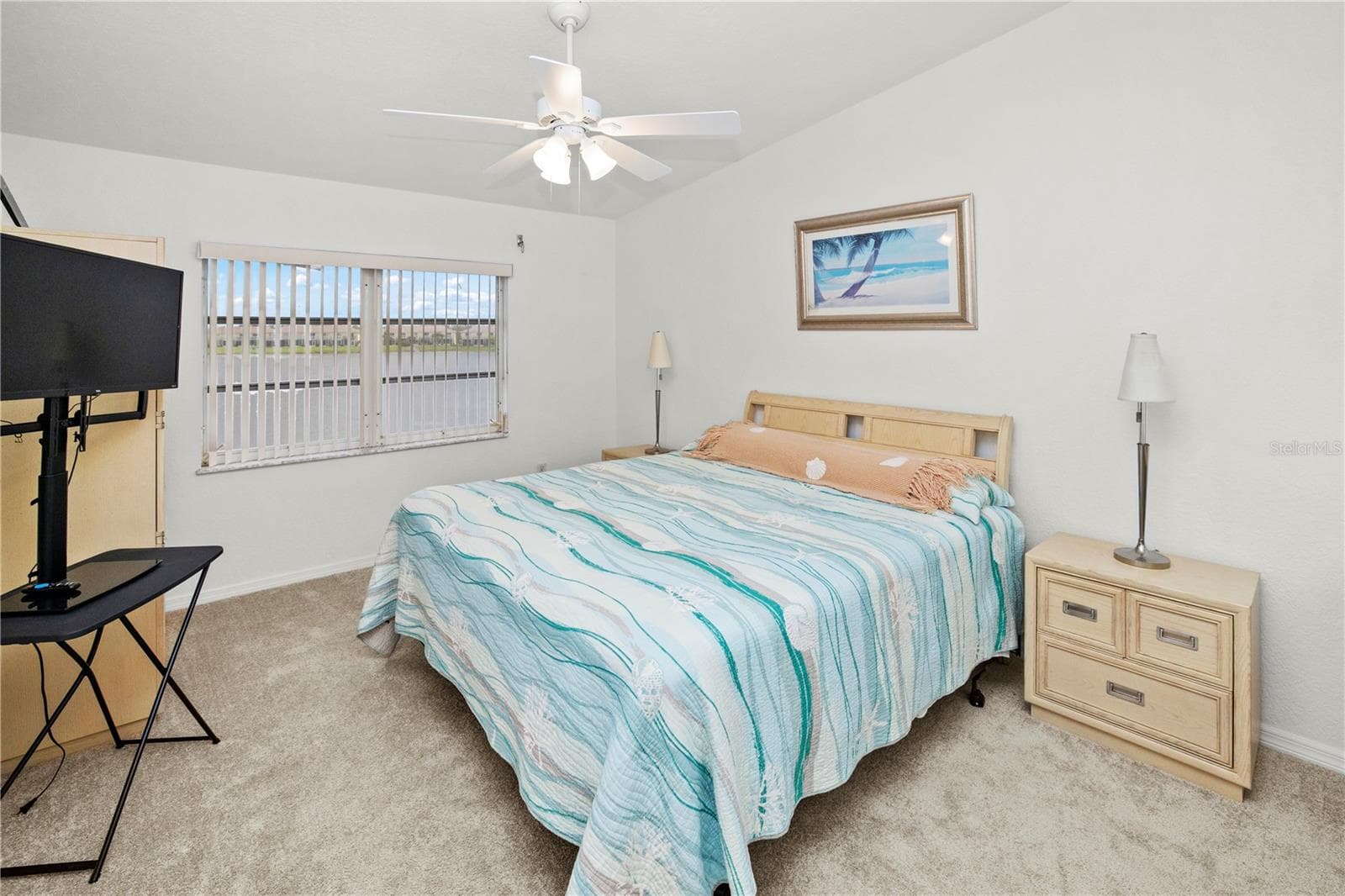 Spacious 12' x 16' Primary Bedroom with Gorgeous Lake Views and Sliders out to the Relaxing Lanai - 26283 NADIR RD #201, PUNTA GORDA