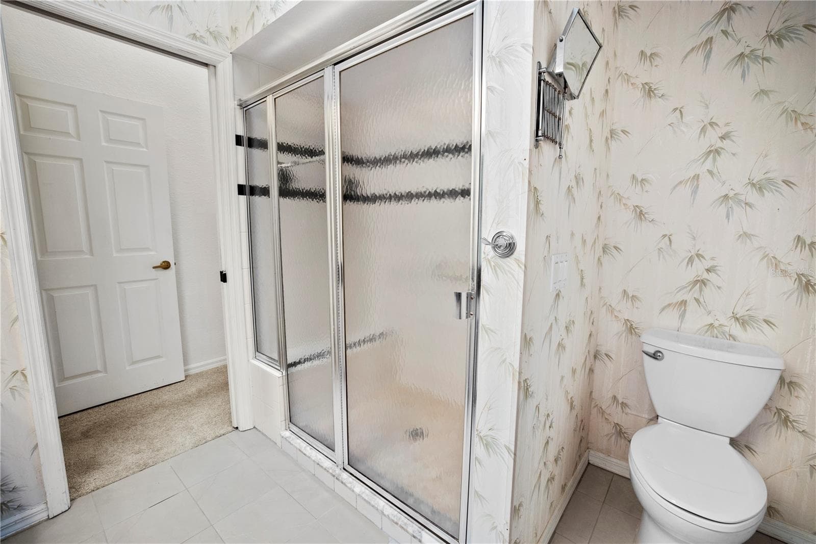Primary Ensuite Bath Boast Dbl Sinks, Walk In Tiled Shower and lots of storage - 26283 NADIR RD #201, PUNTA GORDA