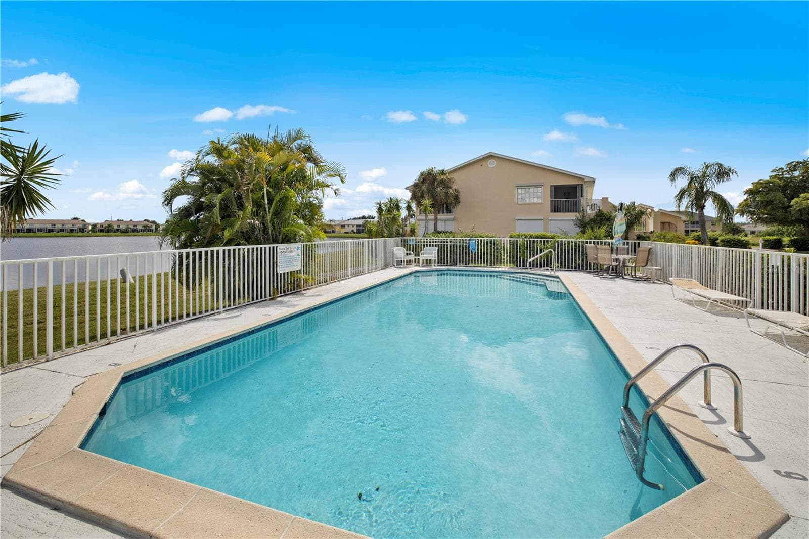 refreshing pool overlooking Lake Rio - 26283 NADIR RD #201, PUNTA GORDA