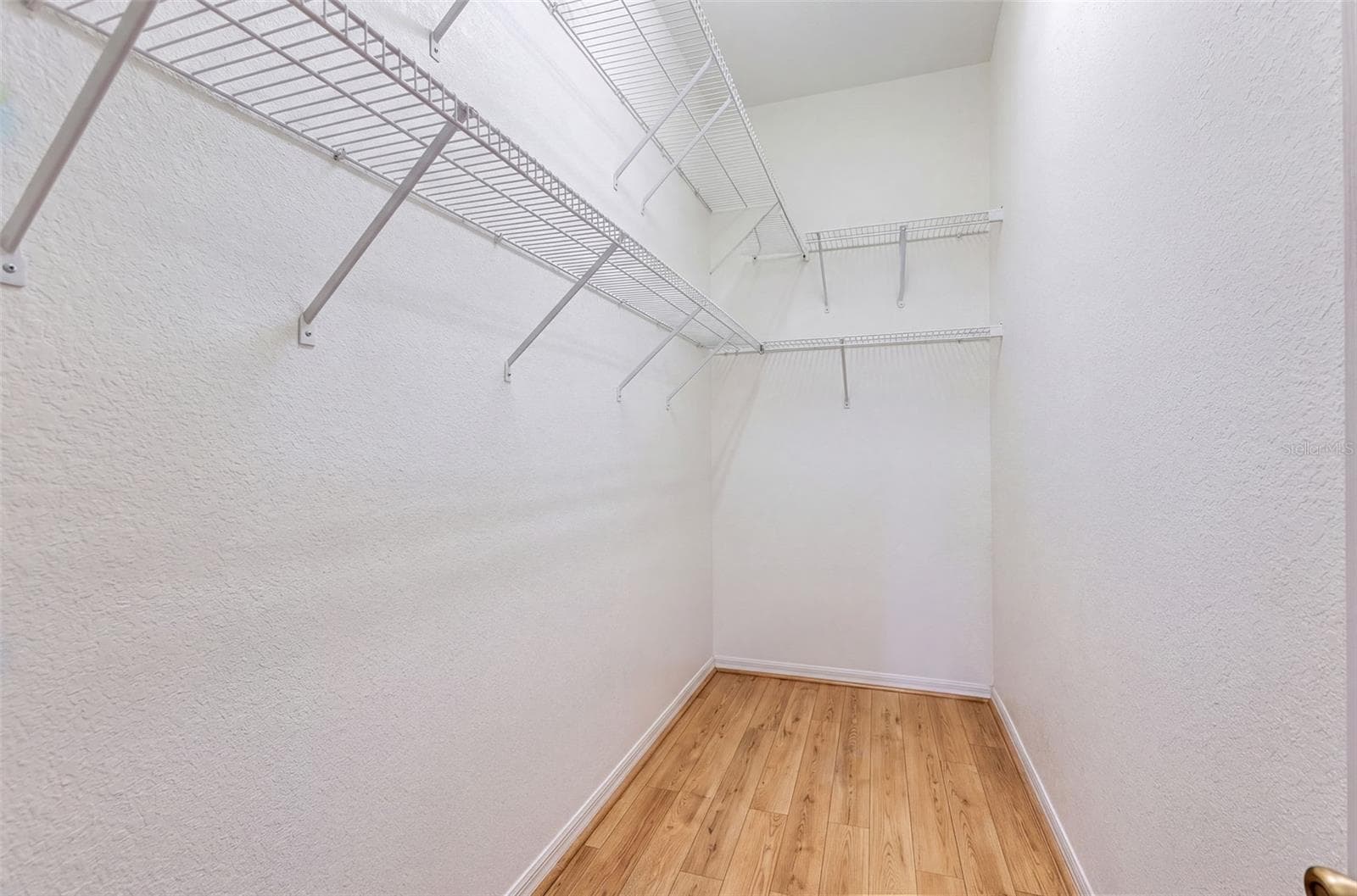 Primary Bedroom Closet - 1717 W ORANGEWOOD LN #4, AVON PARK
