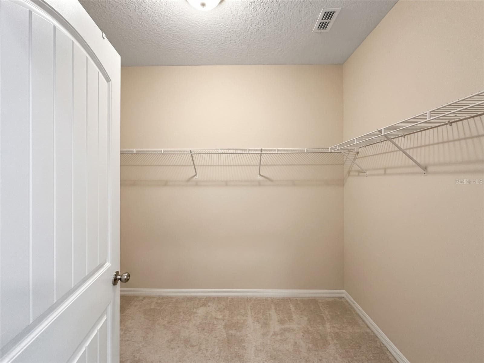 Primary walk-in closet - 9662 WATERWAY PASSAGE DR, WINTER GARDEN