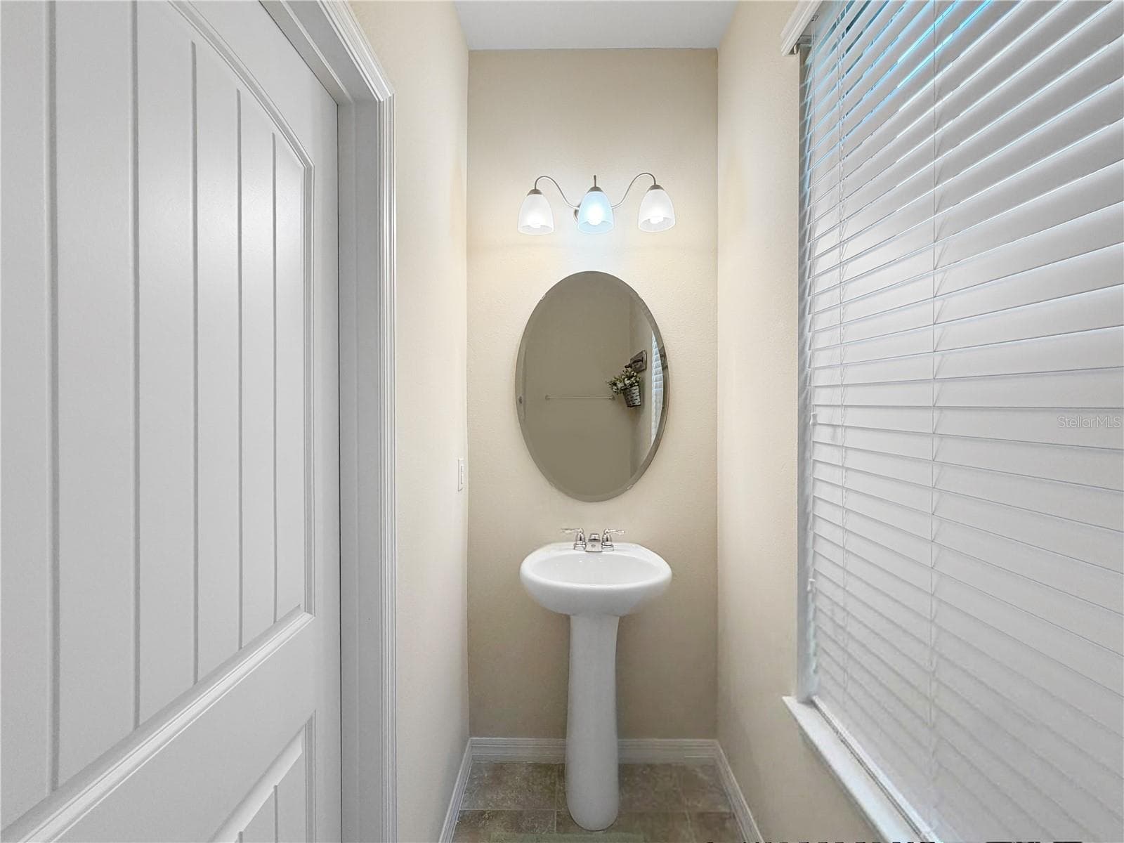 Powder room located downstairs - 9662 WATERWAY PASSAGE DR, WINTER GARDEN
