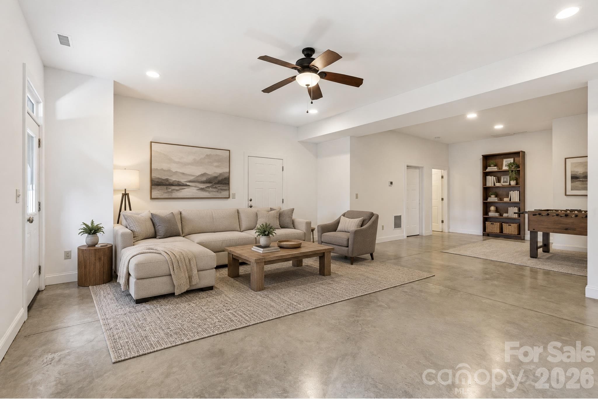 Staged Basement Level Great Room access to 2 Car Garage - 39 Williams Cove Road, Black Mountain