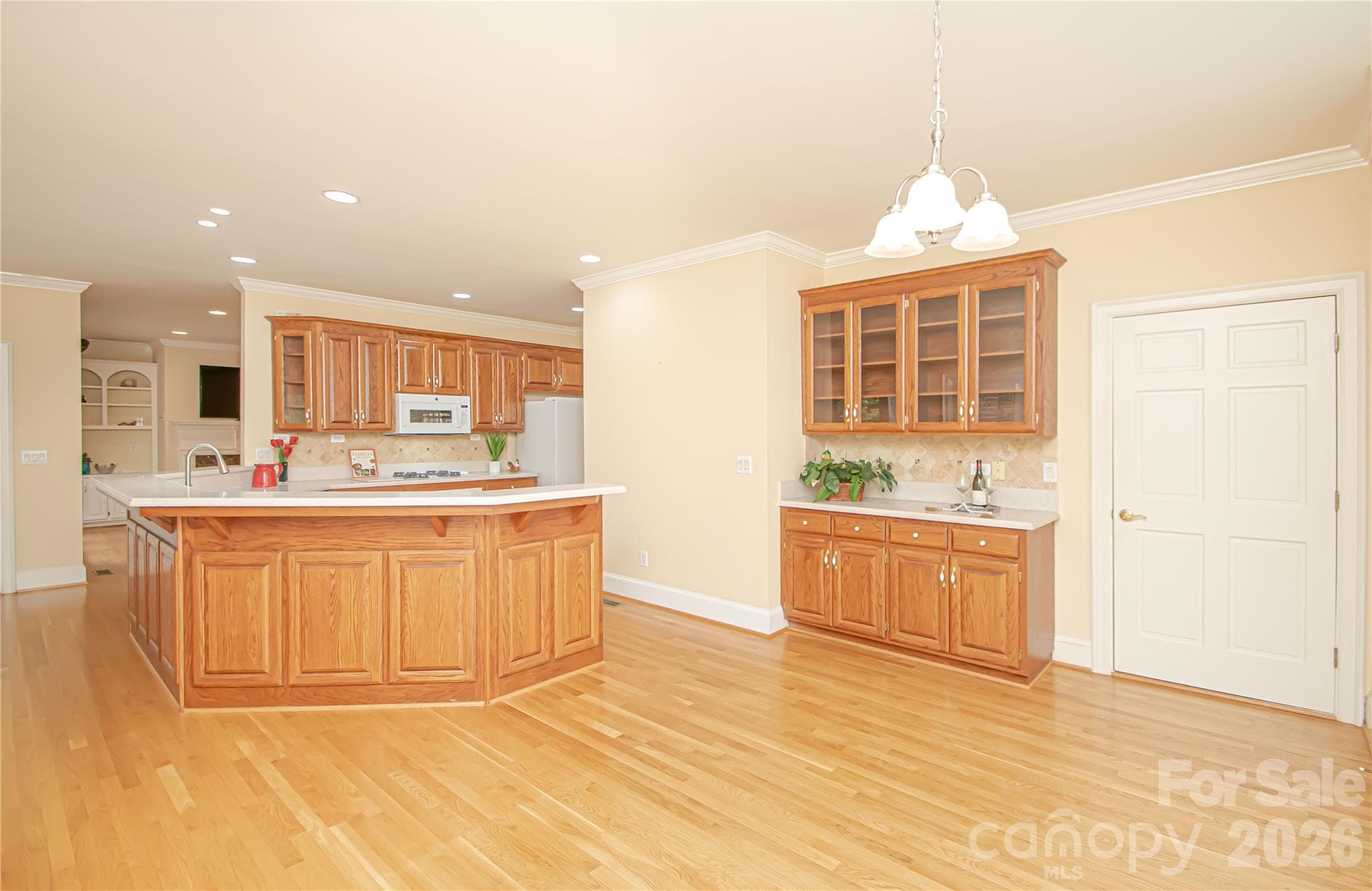 KITCHEN 12'x15': recess lights, above cabinet lights, solid maple 42" cabinets in Oak Stain. - 5480 Glen Forest Drive, Charlotte