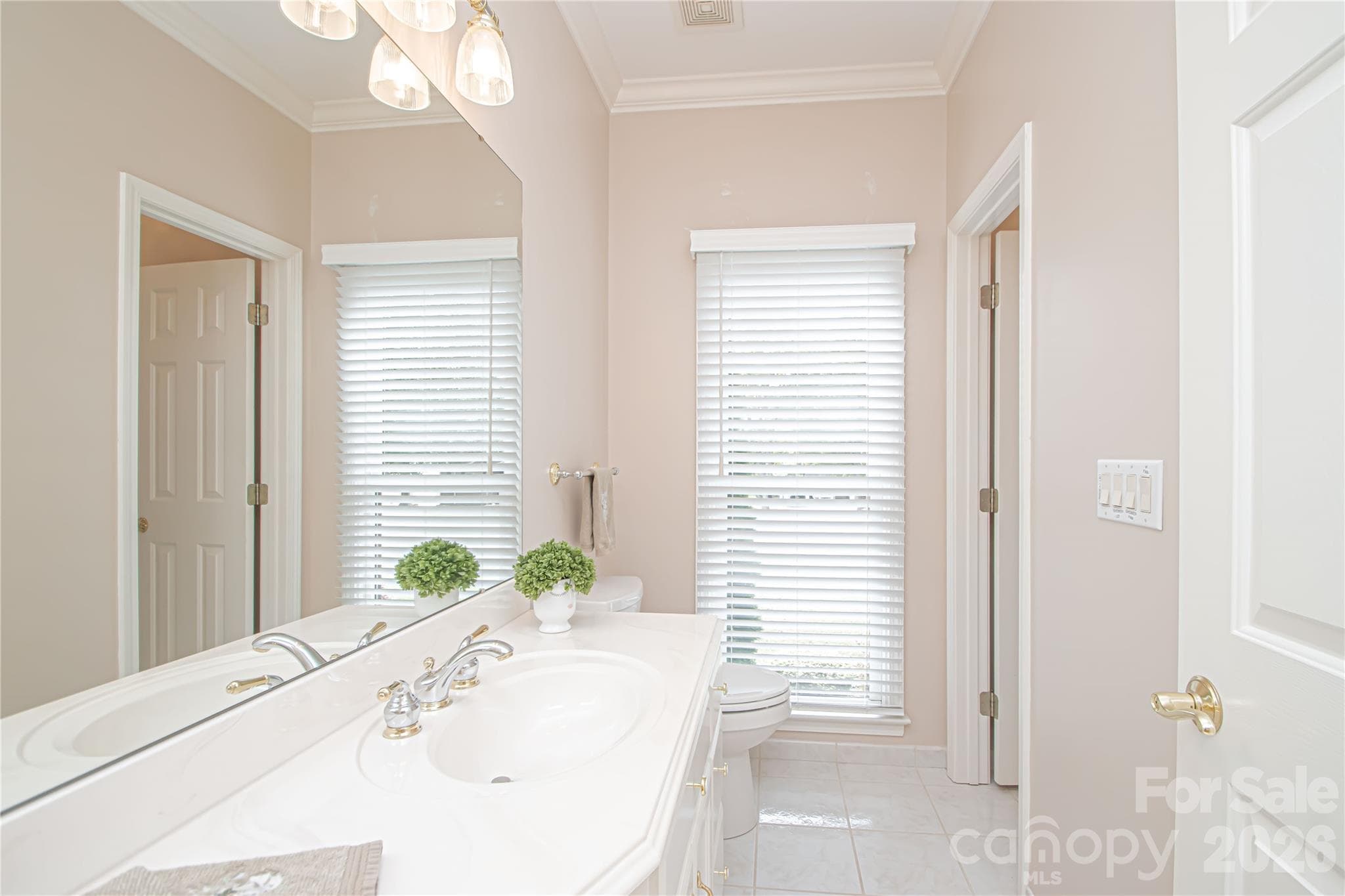 Private HALF BATHROOM for the en-suite corner bedroom. New Blinds. Note the floor to ceiling window. - 5480 Glen Forest Drive, Charlotte
