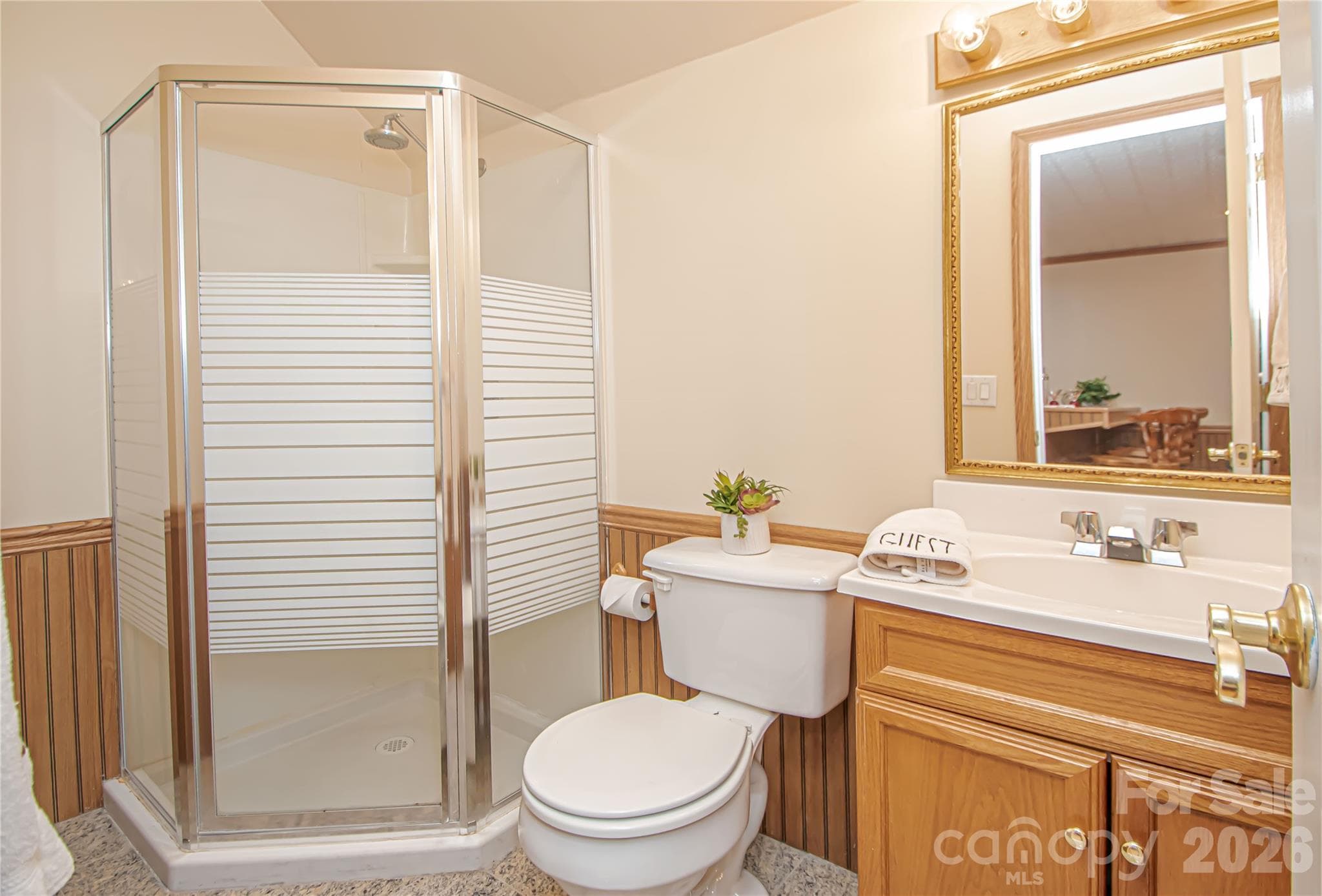 UPSTAIRS FULL BATH: new GFI, wainscotting and granite floor. - 5480 Glen Forest Drive, Charlotte