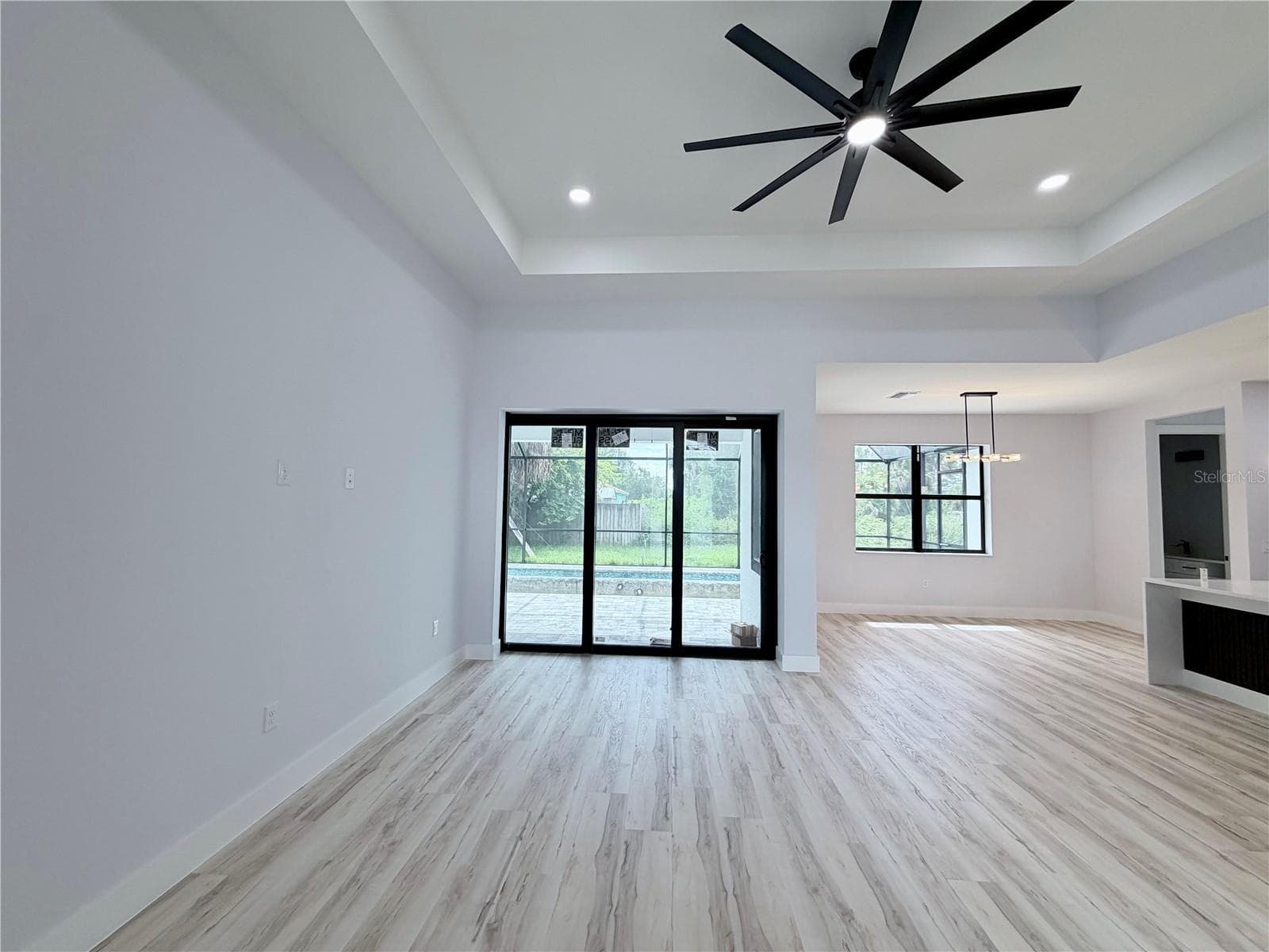 Living Room Pool View - 2675 YACOLT AVE, NORTH PORT