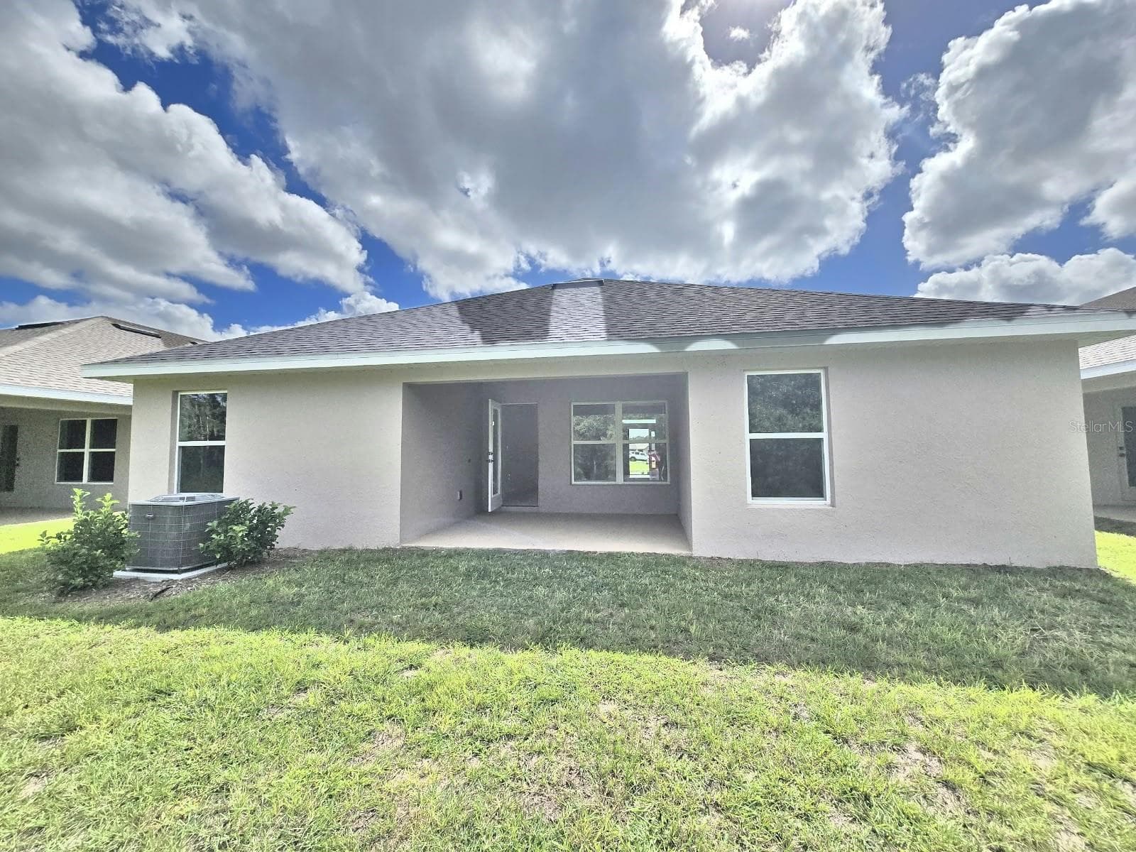 Rear exterior and covered lanai - 7672 BENT TREE LOOP, ST CLOUD