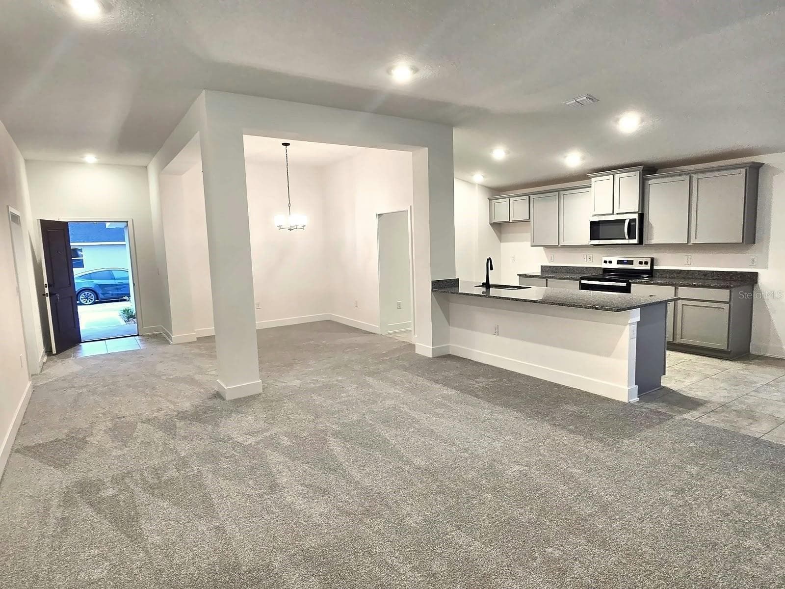 Great room, dining room and kitchen - 7678 BENT TREE LOOP, HARMONY