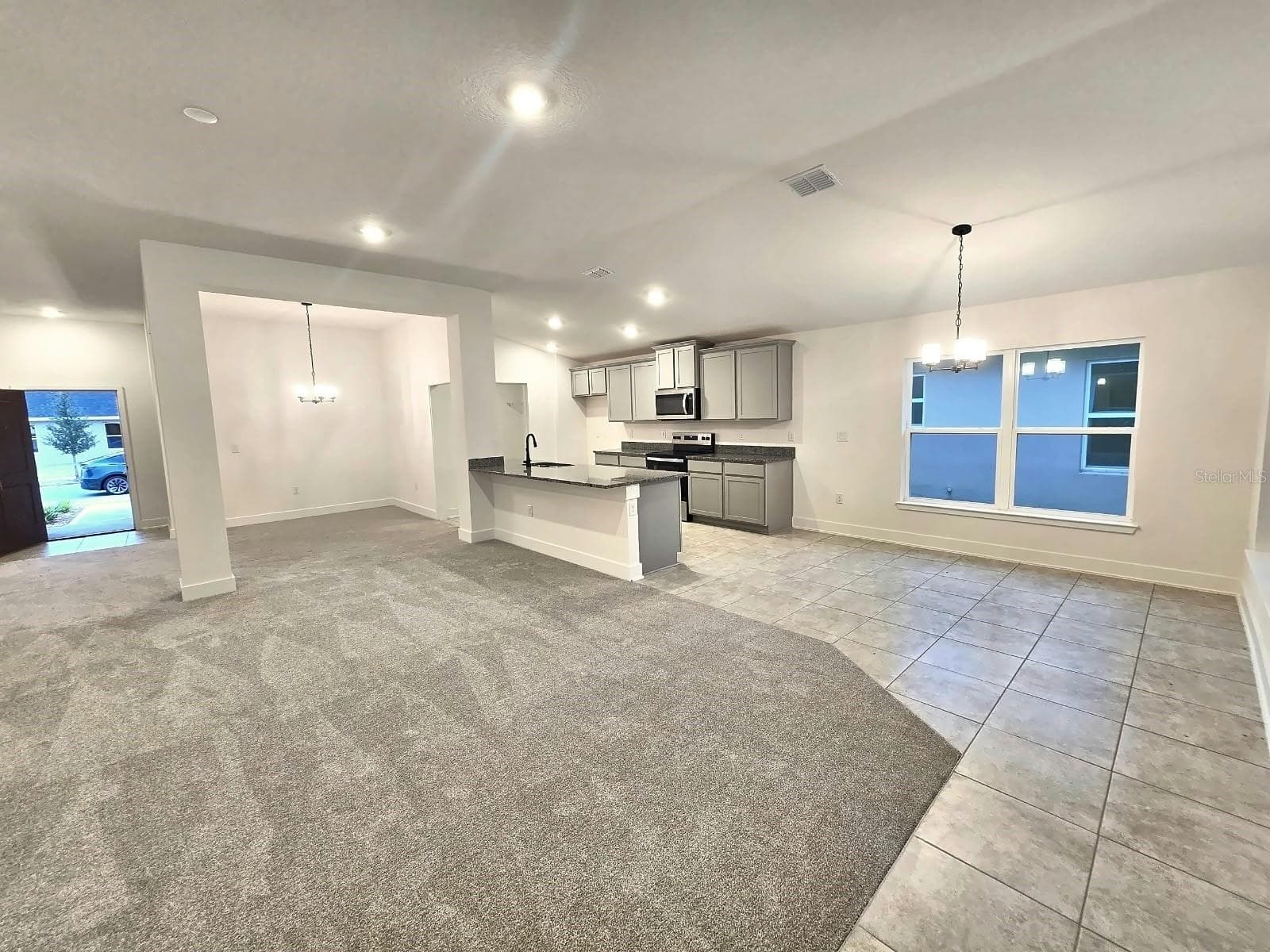 Great room and kitchen - 7678 BENT TREE LOOP, HARMONY