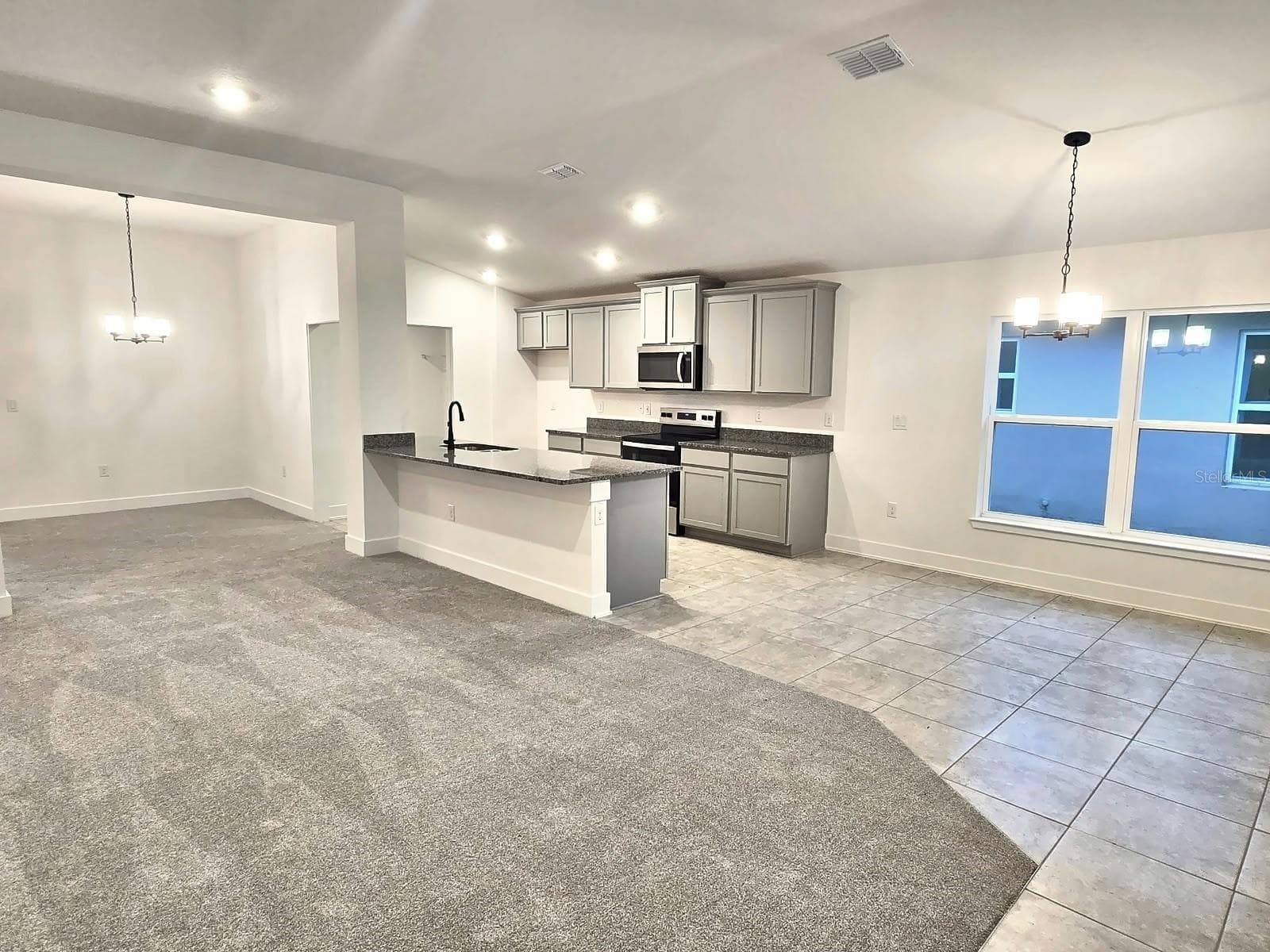 Kitchen and breakfast area - 7678 BENT TREE LOOP, HARMONY