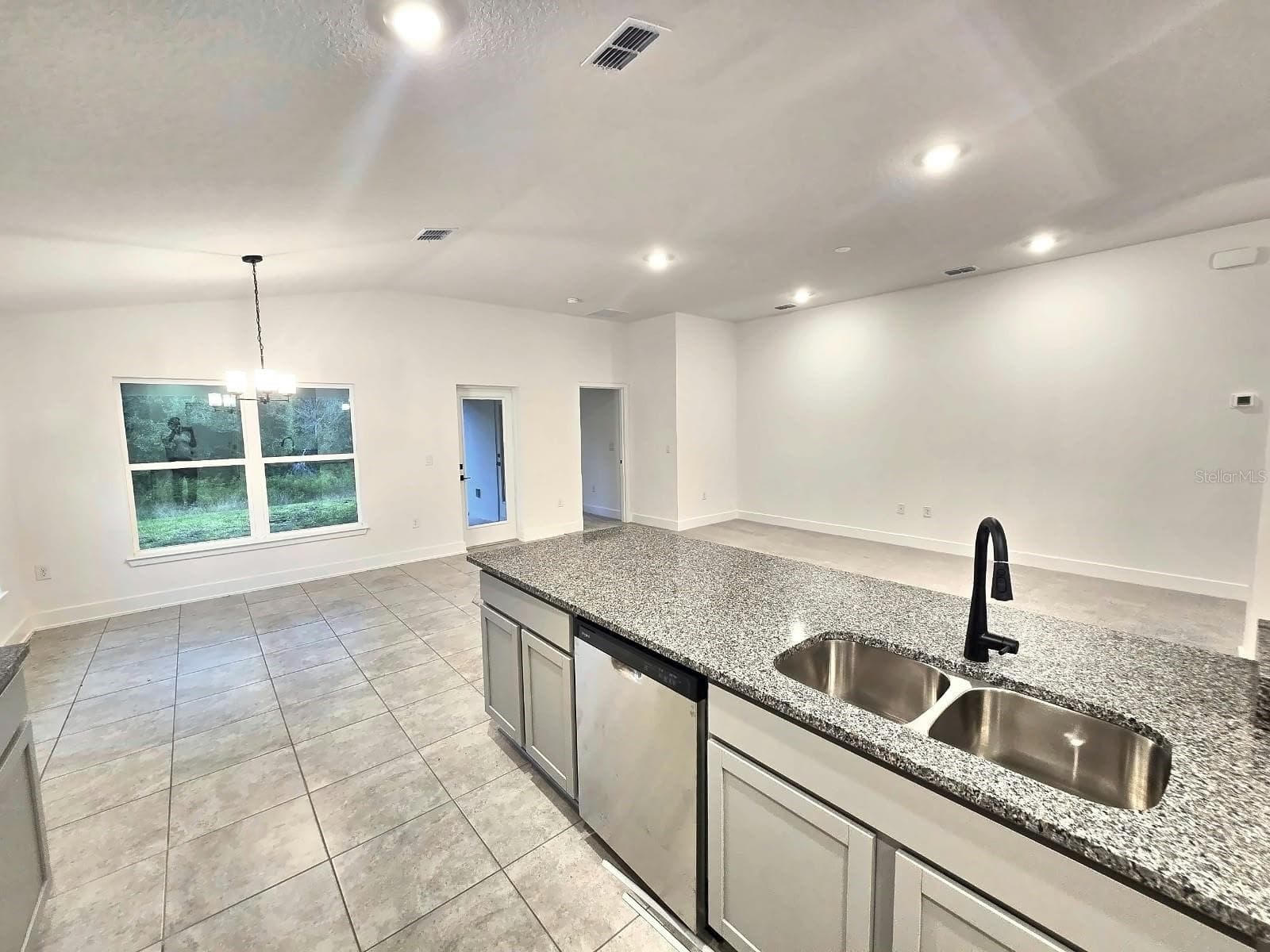 Kitchen island and breakfast nook - 7678 BENT TREE LOOP, HARMONY