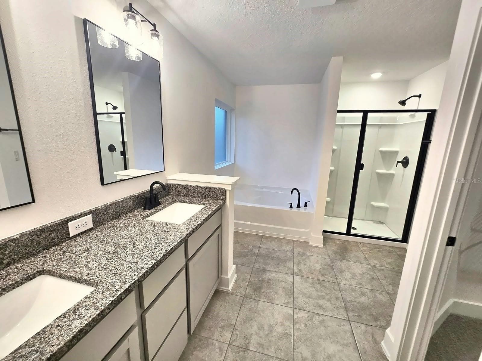 Primary bathroom - 7678 BENT TREE LOOP, HARMONY