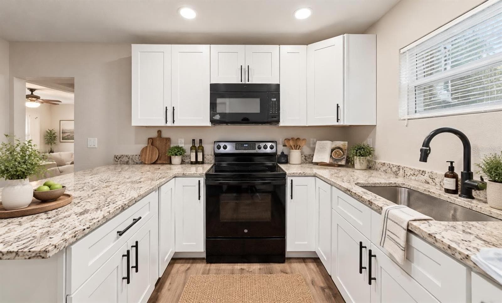 In-law suite kitchen virtually staged - 5106 THONOTOSASSA RD, PLANT CITY