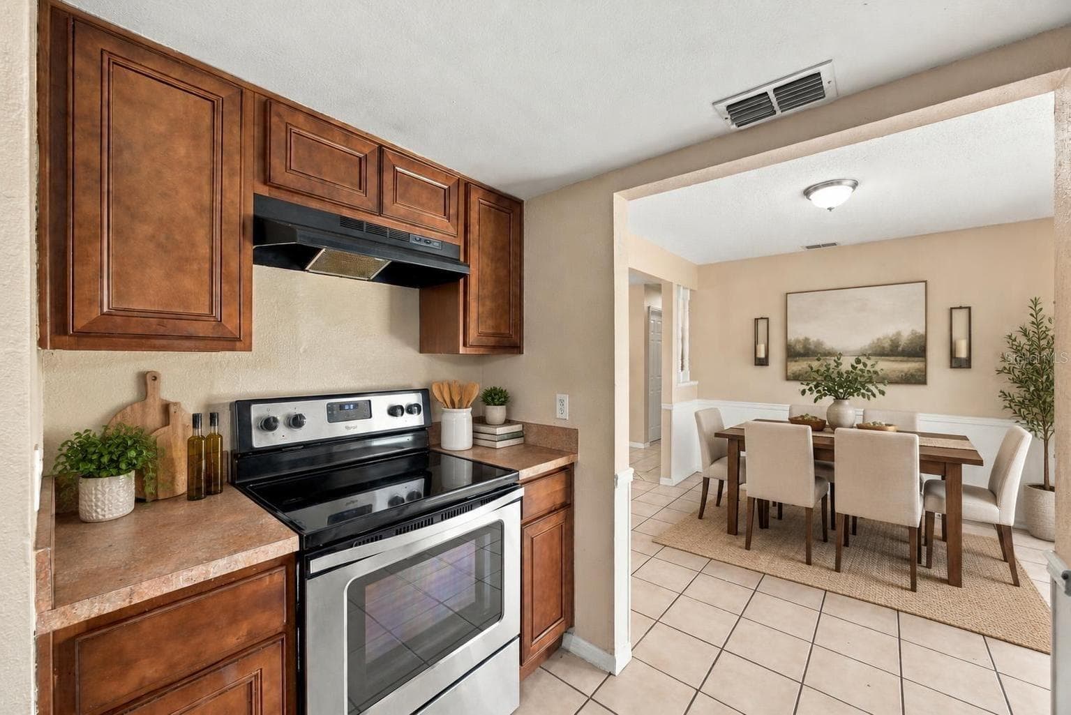 Kitchen/dining area staged - 7021 SHEFFIELD DR, LAKELAND