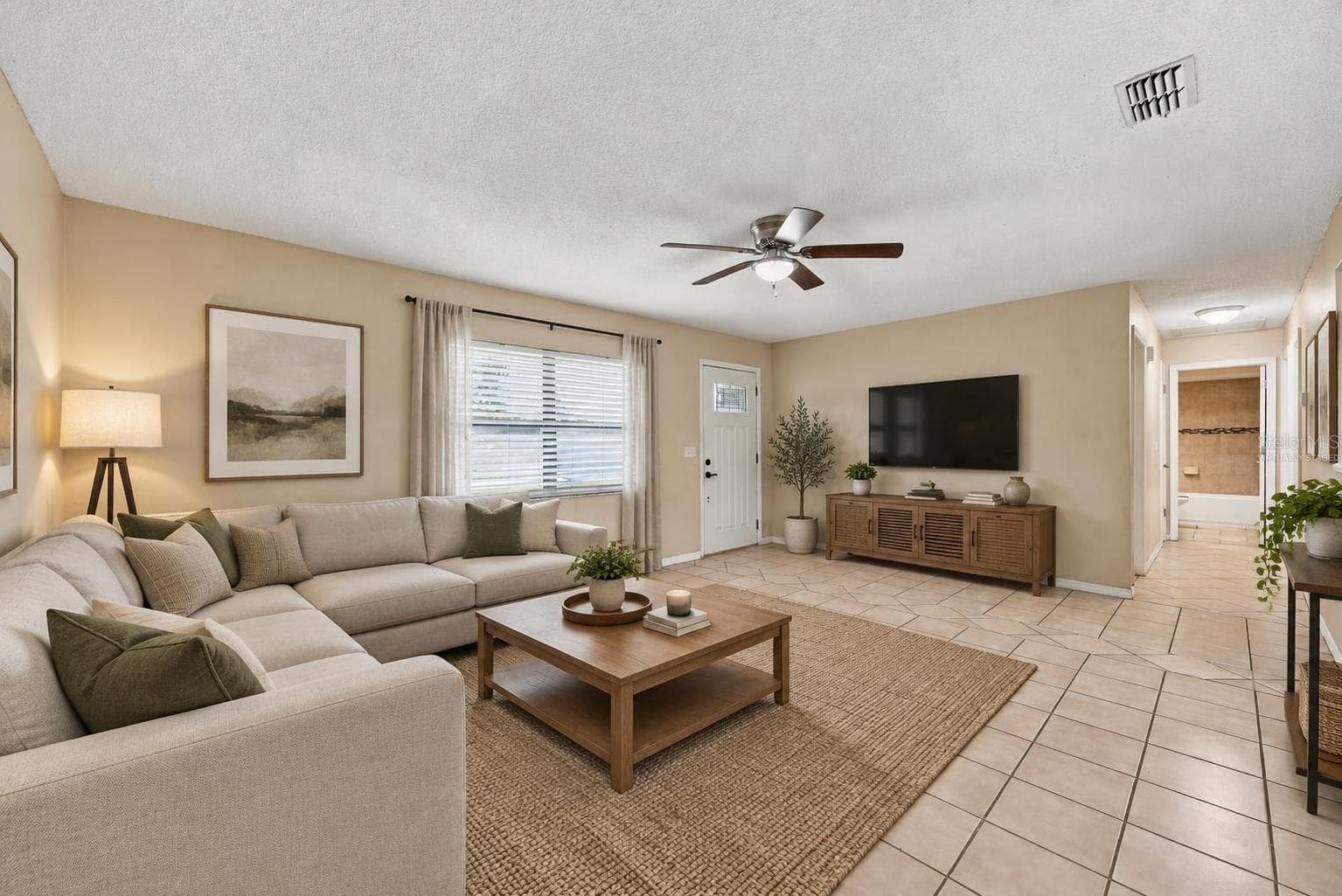 Living area virtually staged - 7021 SHEFFIELD DR, LAKELAND