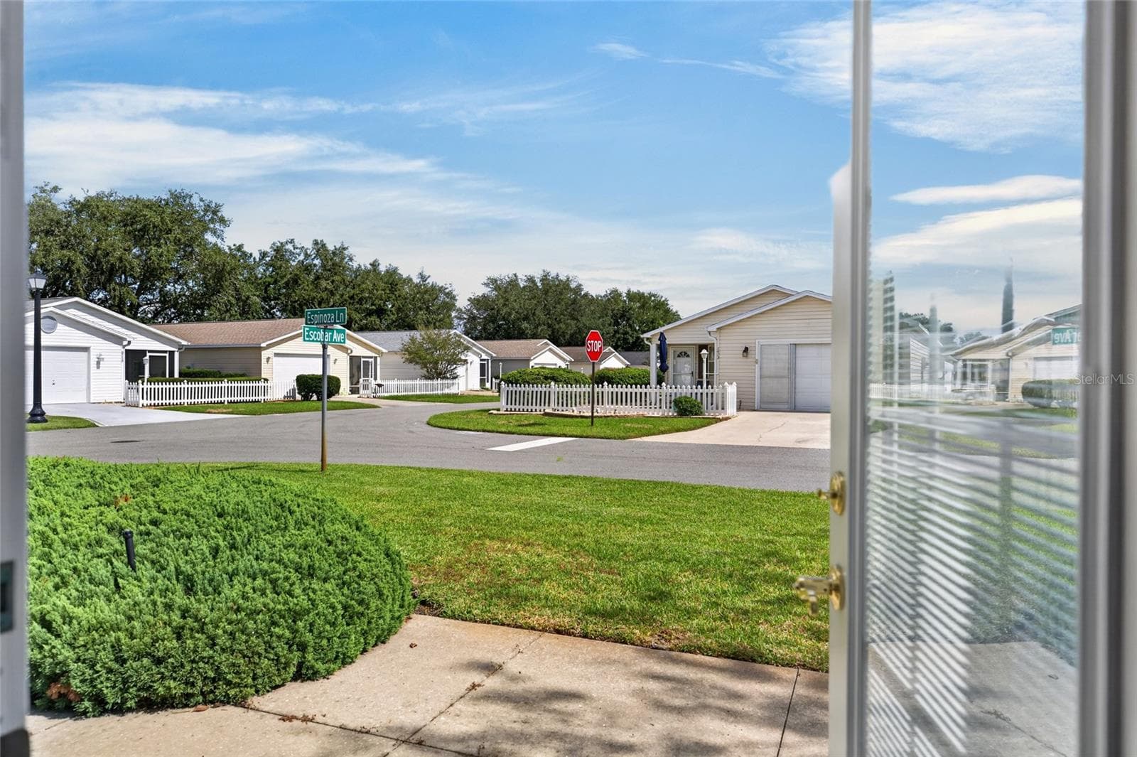 View of OUTDOOR PATIO (eastern side of villa) - Looking out from open FRENCH DOORS. - 2124 ESCOBAR AVE, THE VILLAGES