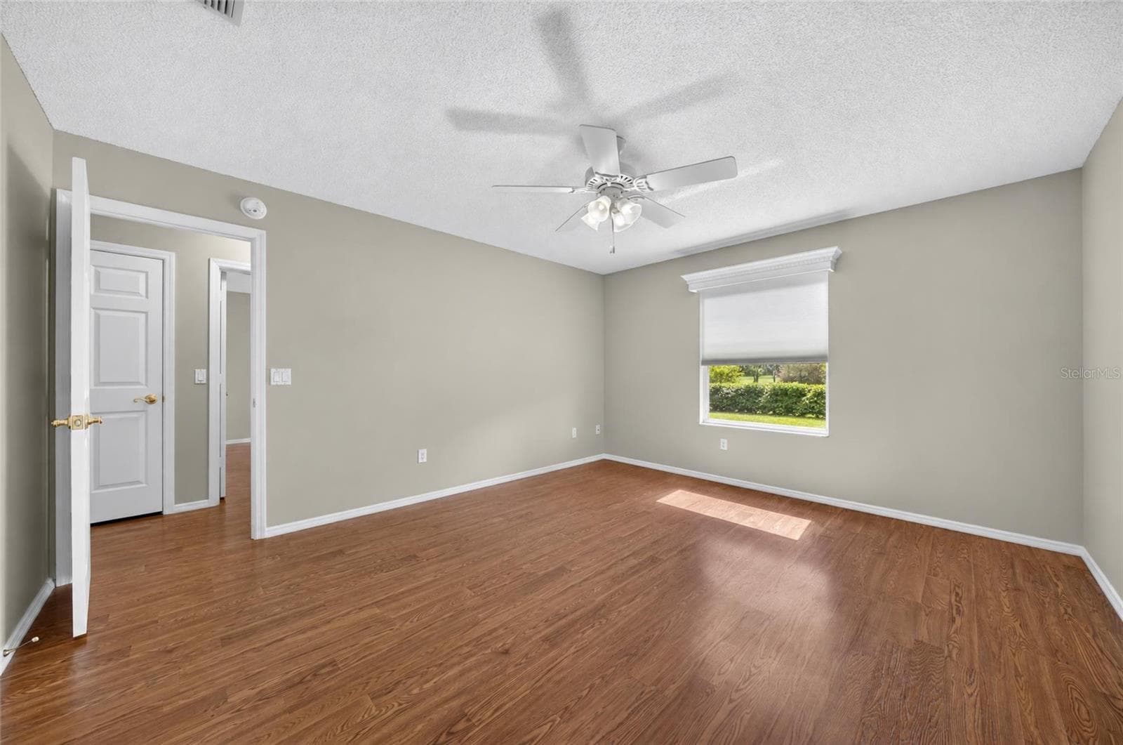 Another view of PRIMARY BEDROOM shows LINEN CLOSET in HALLWAY. - 2124 ESCOBAR AVE, THE VILLAGES