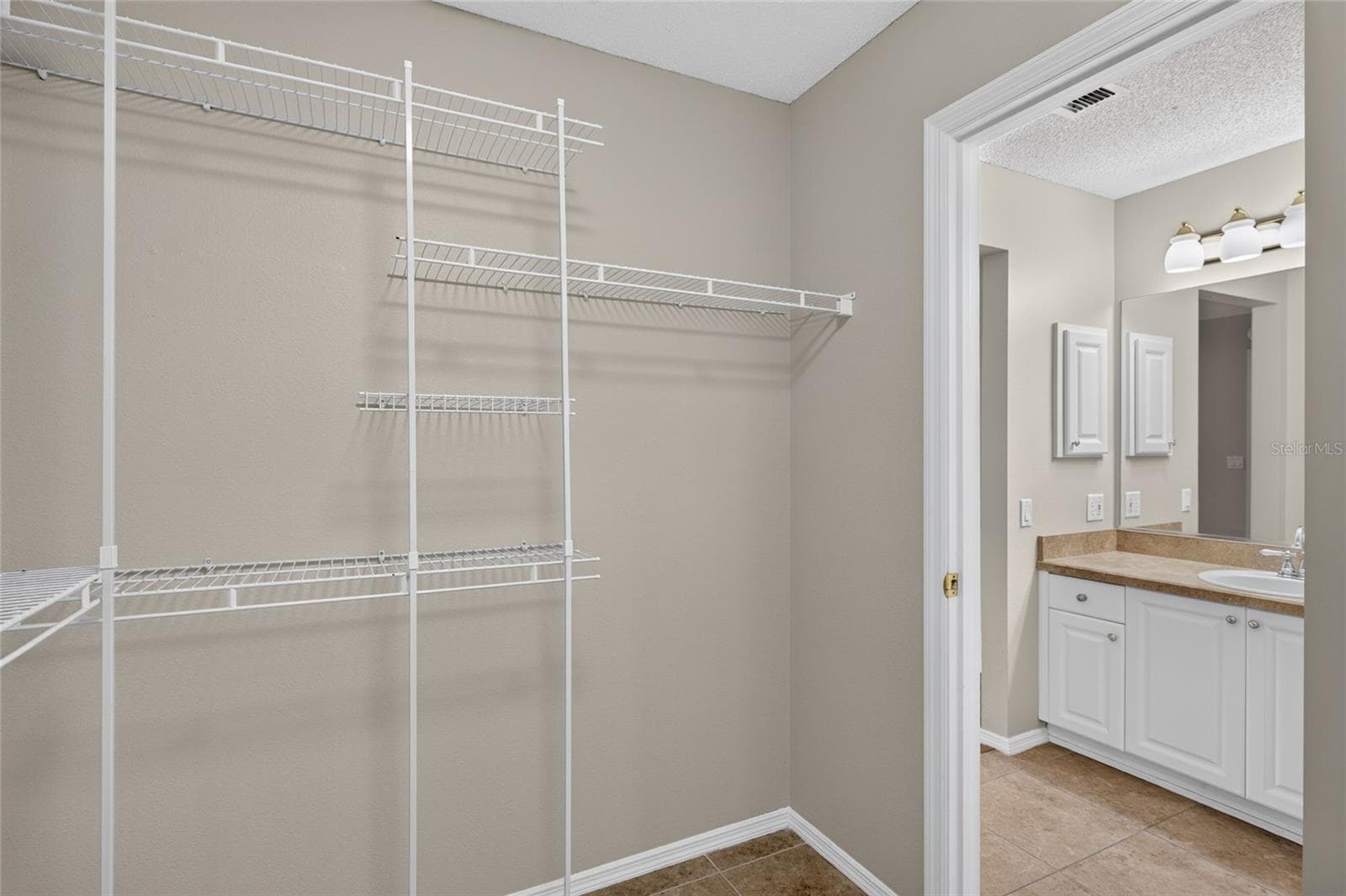 Another view of the interior of the WALK-IN CLOSET - 2124 ESCOBAR AVE, THE VILLAGES