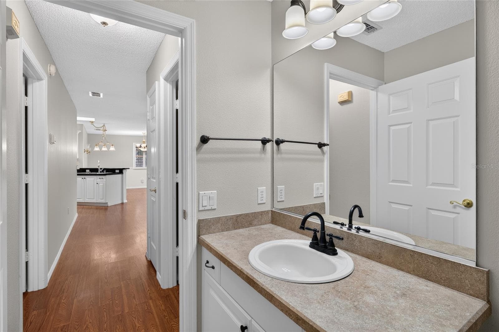 View from BATHROOM #2 - View from the vanity looking back toward the HALLWAY and the main living area. - 2124 ESCOBAR AVE, THE VILLAGES