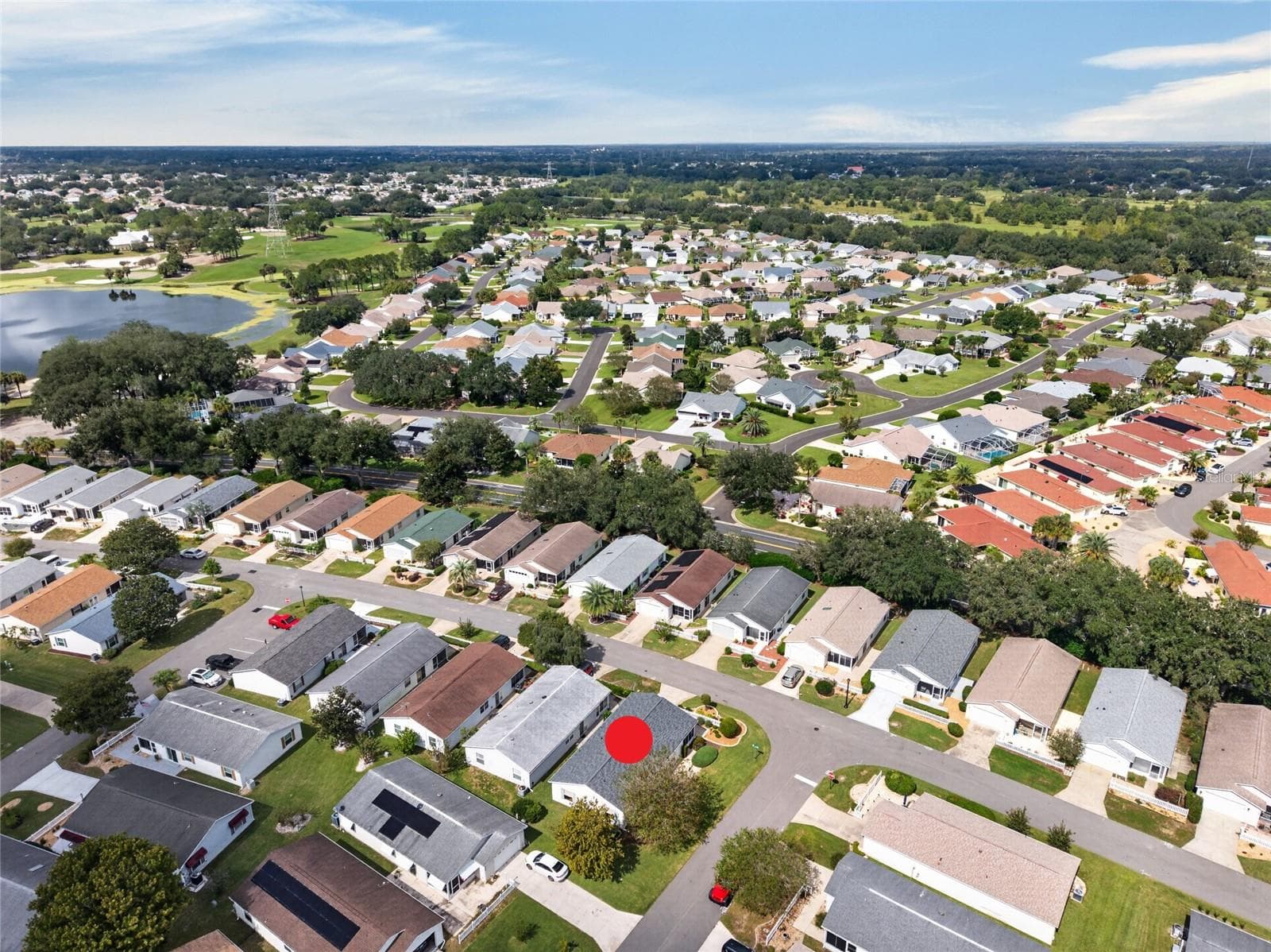 AERIAL – Looking Northwest – Tree-lined streets lead toward the lake and fairways of the El Diablo and El Santiago Executive Golf Courses, with El Santiago Recreation Center's pool and tennis courts close to home. - 2124 ESCOBAR AVE, THE VILLAGES