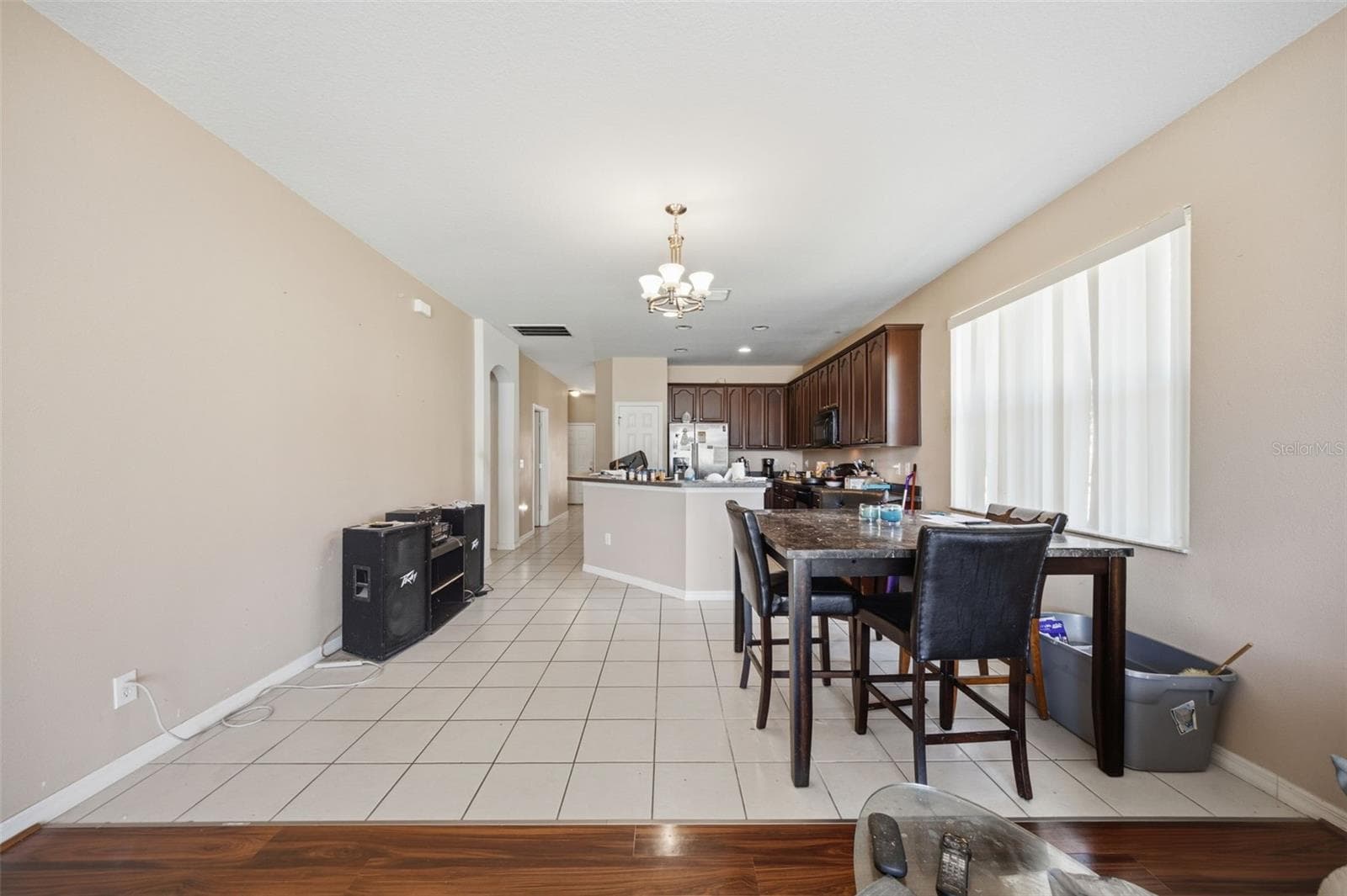Nook and kitchen viewed from family room, with long tiled walkway to foyer - 10328 CELTIC ASH DR, RUSKIN