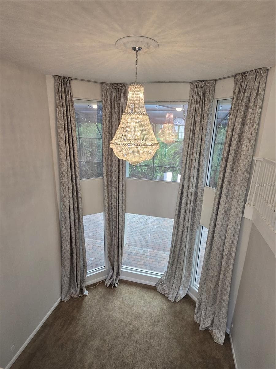 Formal living area, soaring ceilings, architectural features. - 3405 HEIRLOOM ROSE PL, OVIEDO