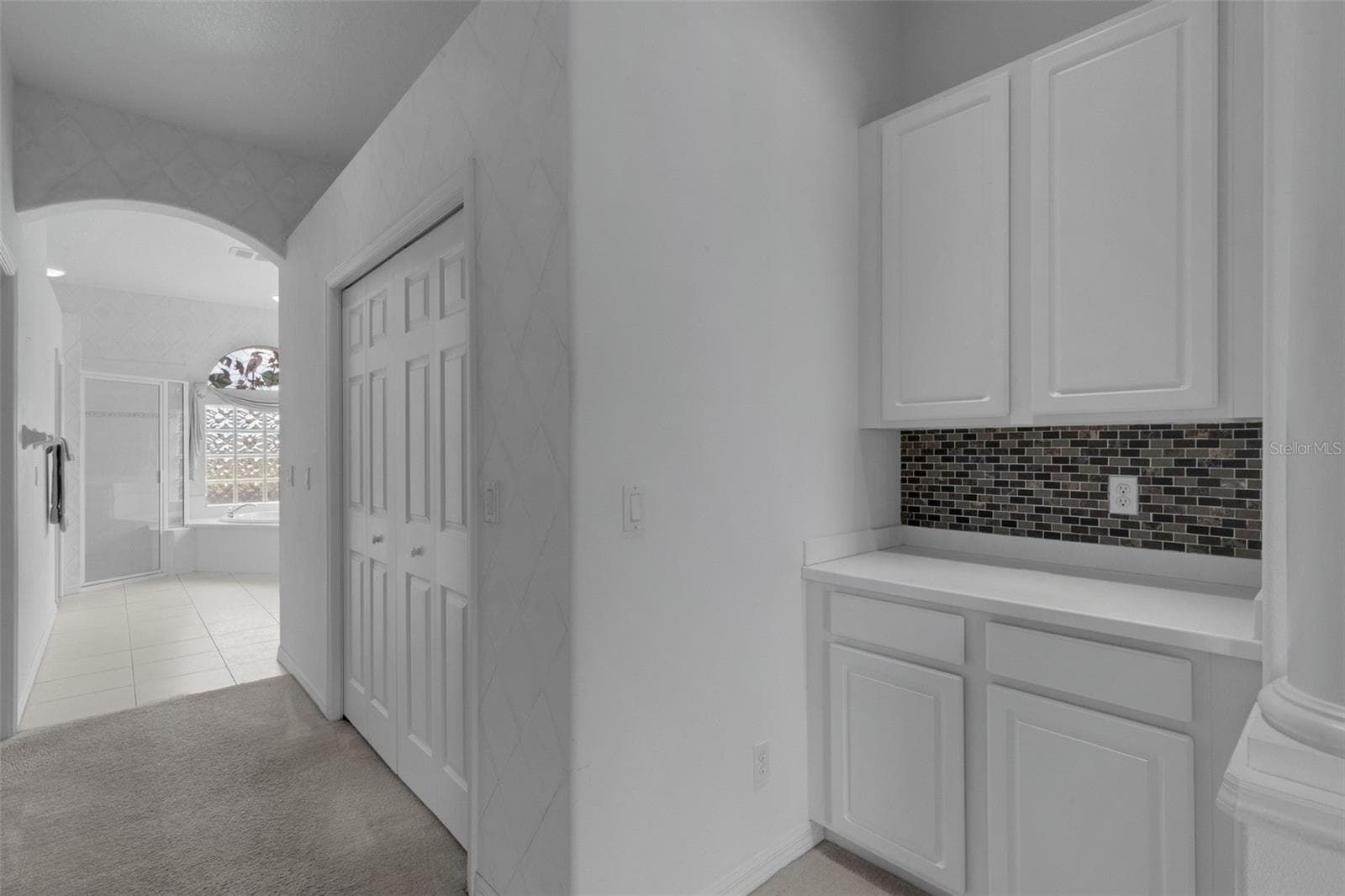 primary bedroom entrance to primary bath - 8339 BARTON FARMS BLVD, SARASOTA