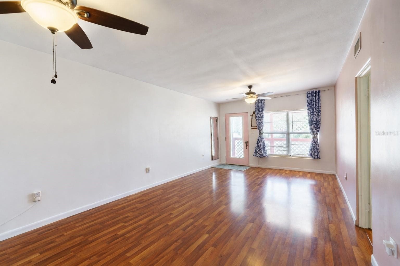Lots of natural light in great room and dining area--trim on porch has been painted green since this picture was taken - 3523 SE 6TH ST, OCALA