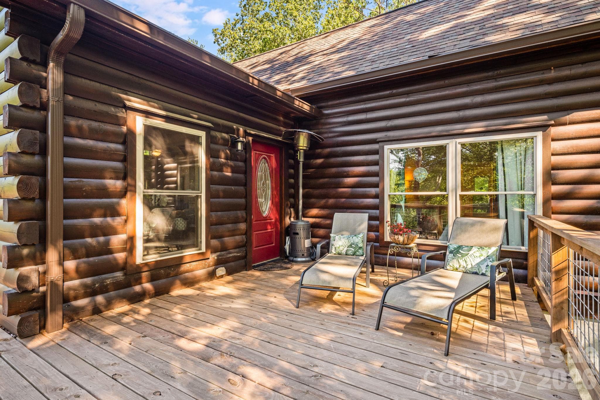 Sitting Area on Wrap Around Deck outsde Living Room and Primary Bedroom Window - 576 Pheasant Street, Lake Lure