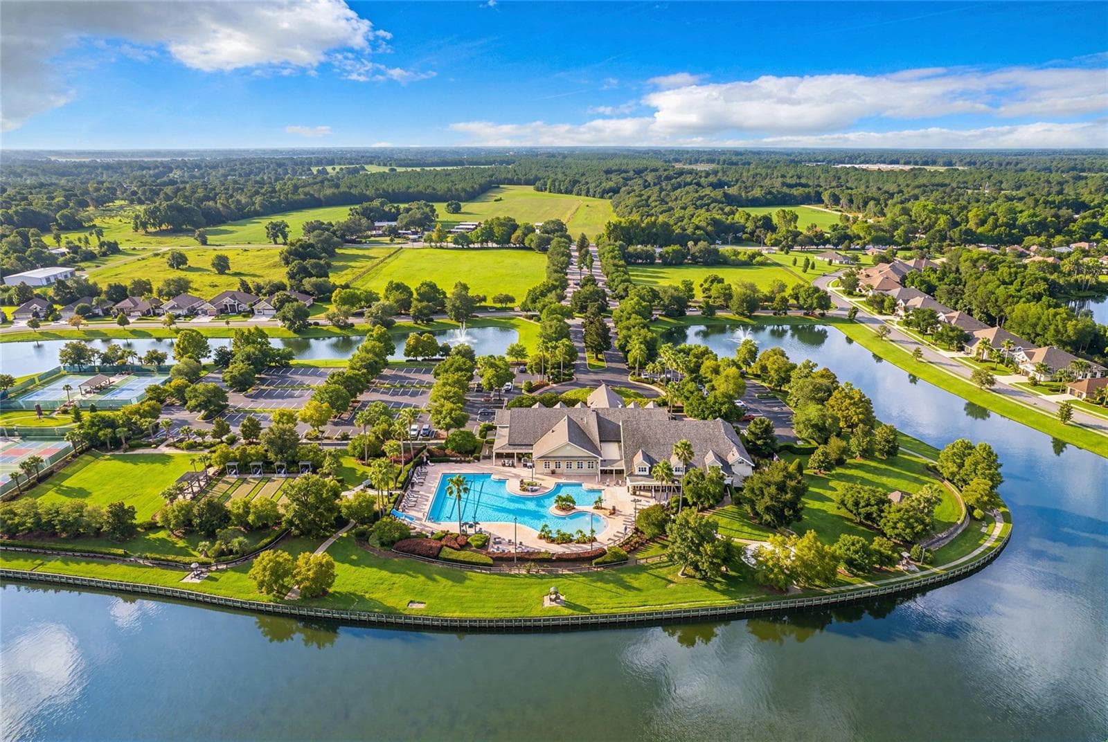 18,000 sq ft clubhouse with Olympic-size, resort-style heated pool, tennis, bocce ball and pickleball courts. Along with a hot tub, croquet lawn, basketball court, community fire pit and waterfront fitness trails. - 8301 BRIDGEPORT BAY CIR, MOUNT DORA