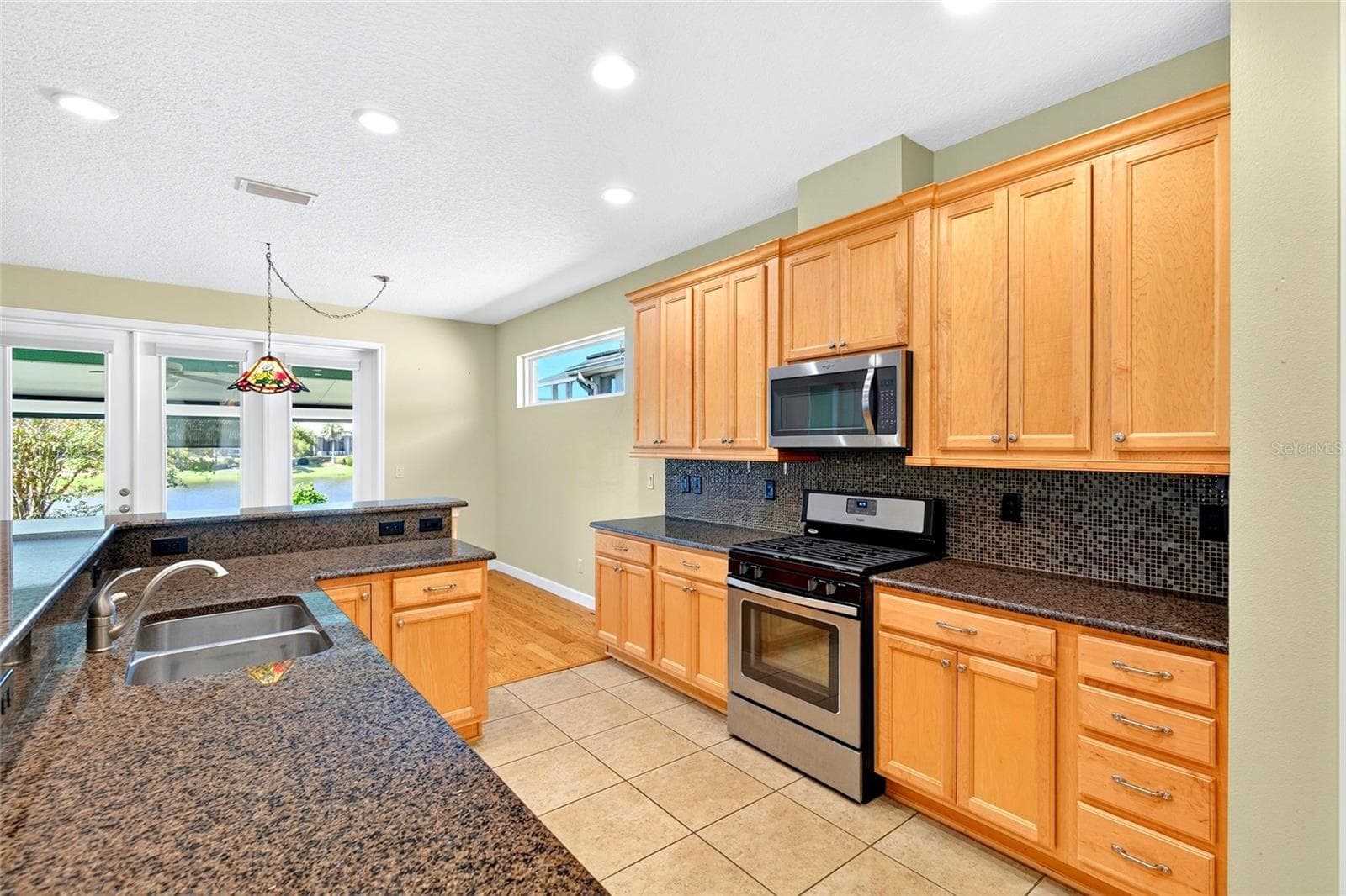 Tons of counterspace. - 8301 BRIDGEPORT BAY CIR, MOUNT DORA