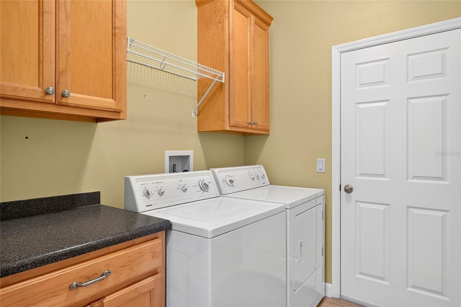 Laundry room with garage access. - 8301 BRIDGEPORT BAY CIR, MOUNT DORA