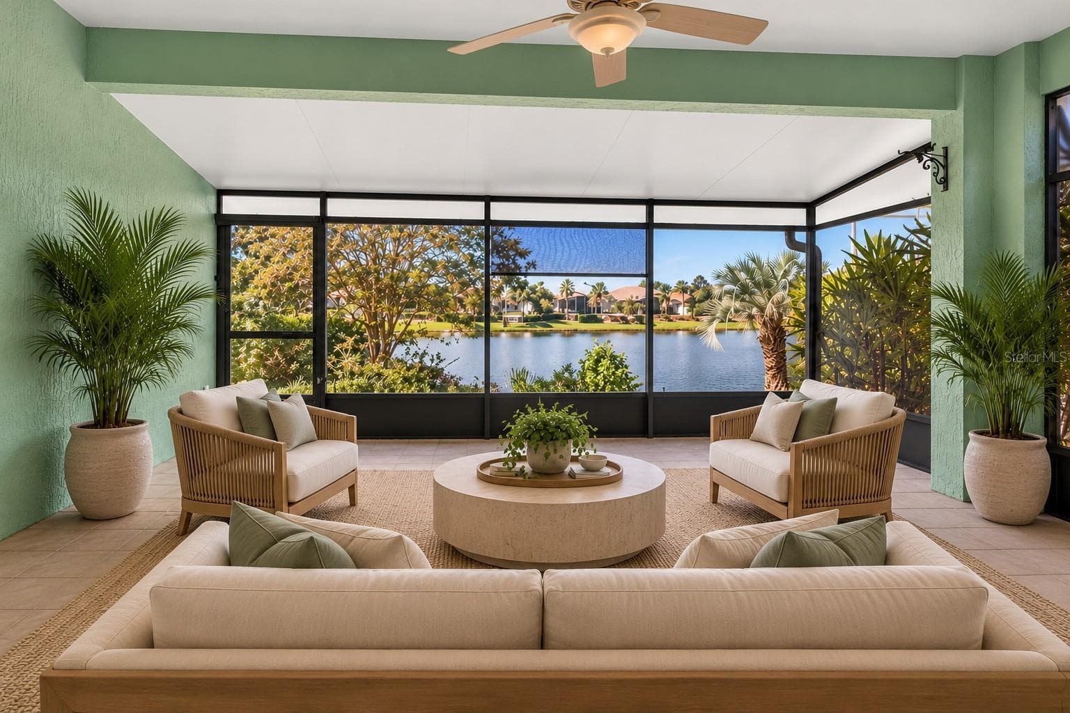Enclosed lanai with lake view. - 8301 BRIDGEPORT BAY CIR, MOUNT DORA
