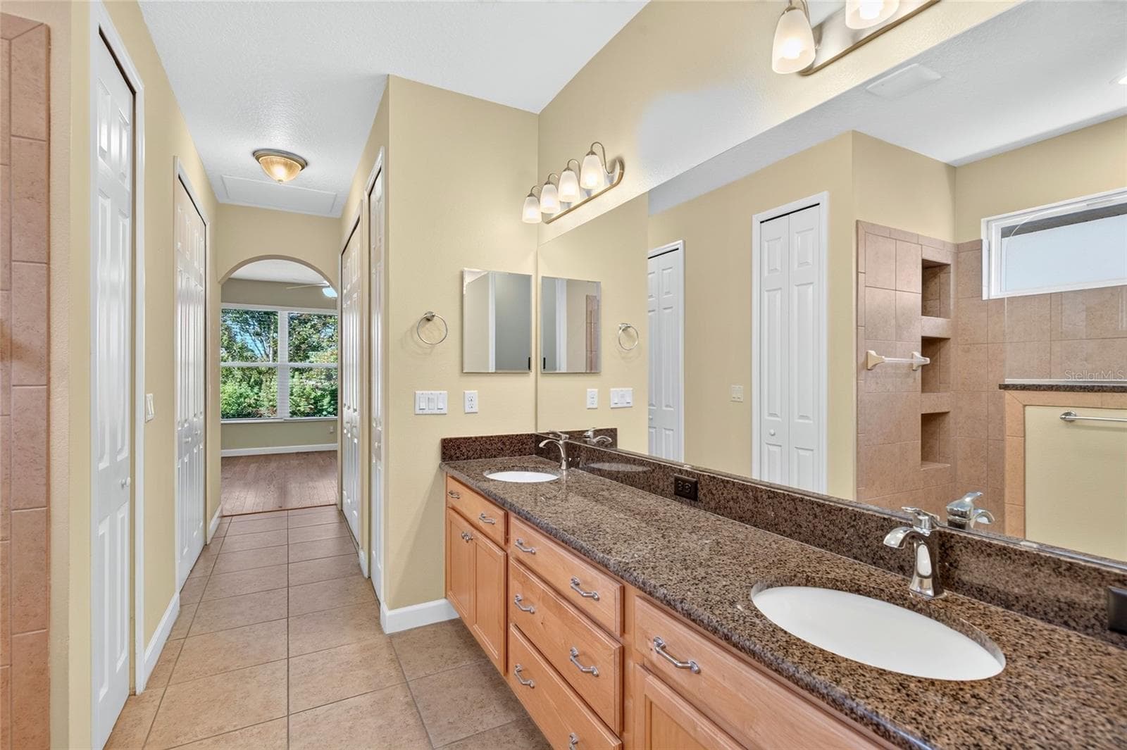 Linen closet and large walk-in closet on the left. Additional spacious closet on the right. - 8301 BRIDGEPORT BAY CIR, MOUNT DORA
