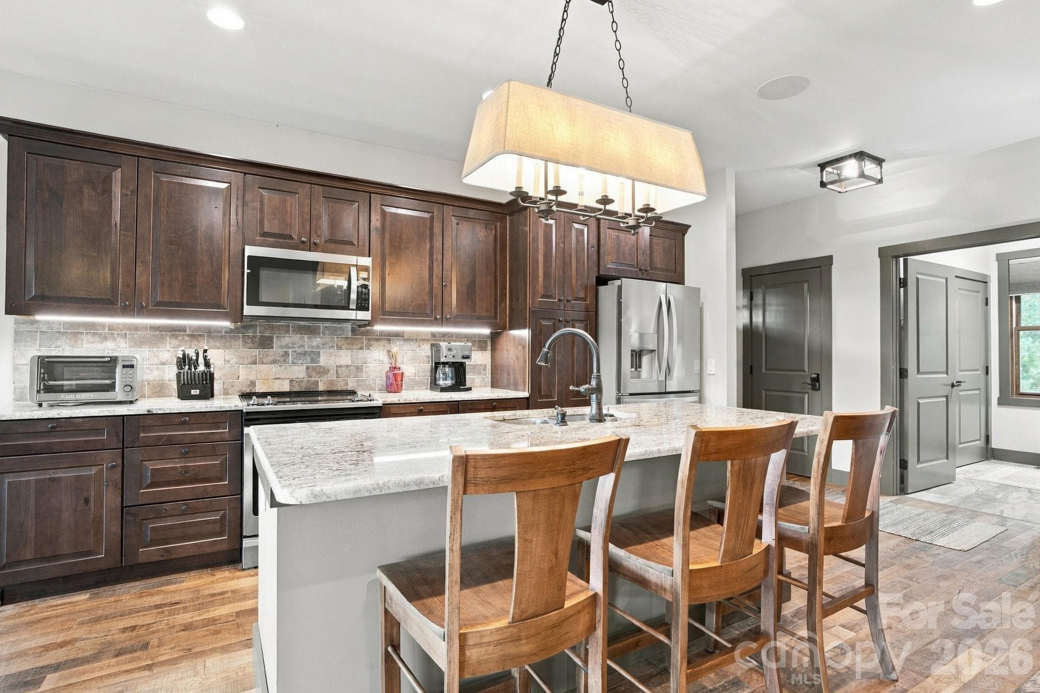Kitchen with a view into the laundry room - 1206 River Stone Drive, Laurel Springs
