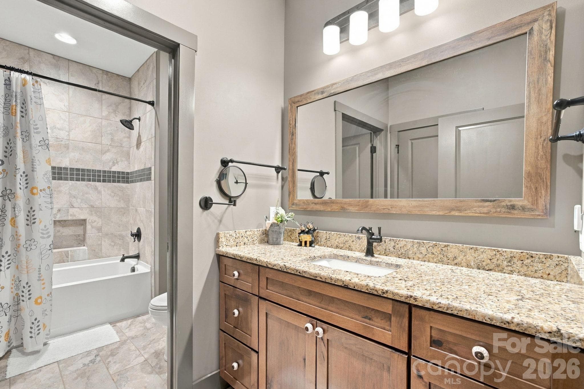 Shared full bathroom on main floor with bedroom 2 and 3 - 1206 River Stone Drive, Laurel Springs