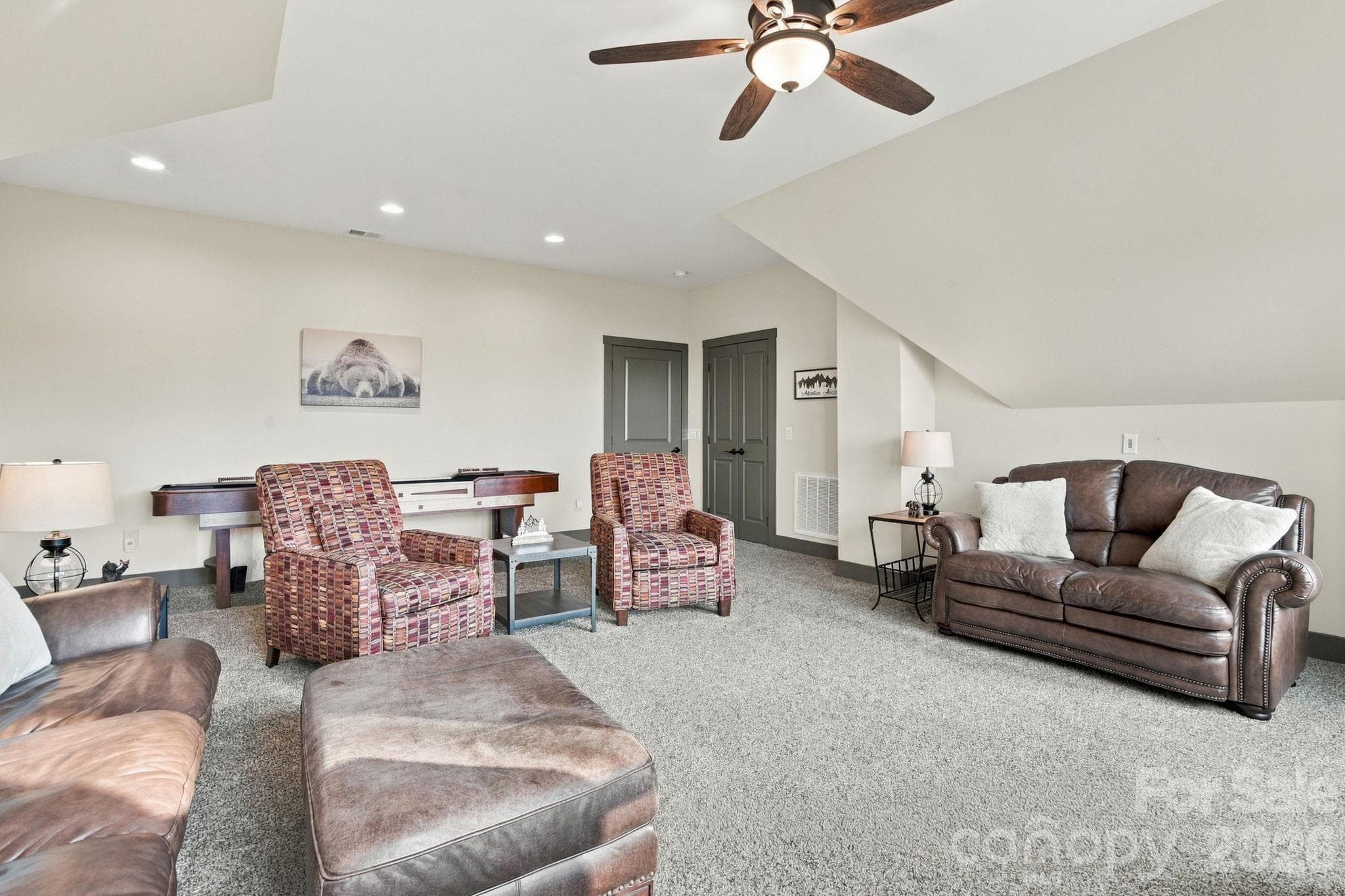 Bonus room on second floor with ceiling fan, plus carpet, and a shuffleboard game table. Plus, closet for 4th bedroom - 1206 River Stone Drive, Laurel Springs