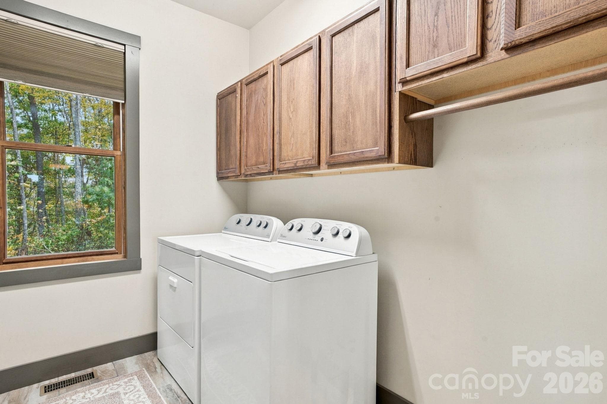 Laundry room with utility closet - 1206 River Stone Drive, Laurel Springs