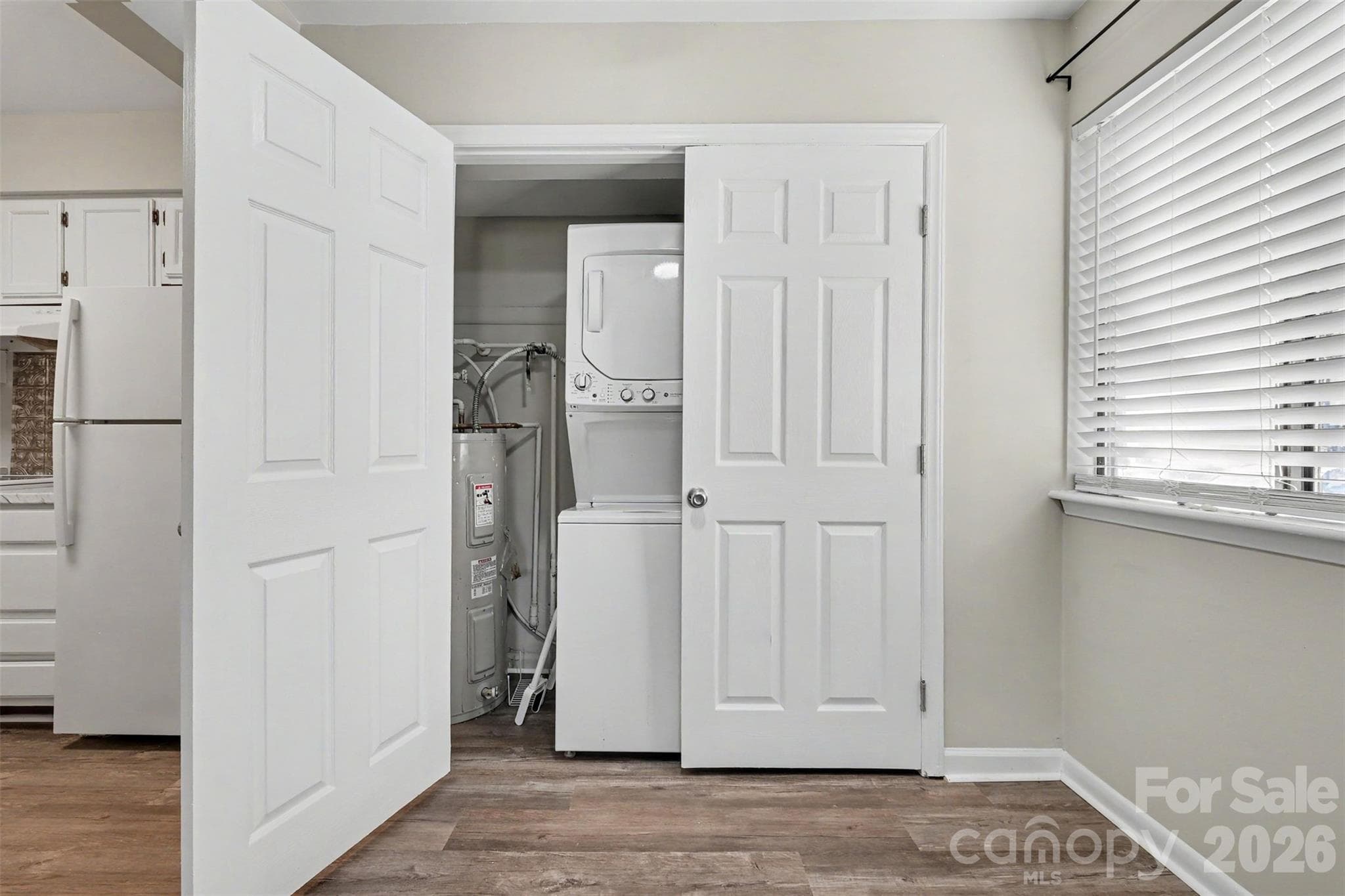 STACK WASHER AND DRYER IN LAUNDRY CLOSET - 3201 Heathstead Place, Charlotte