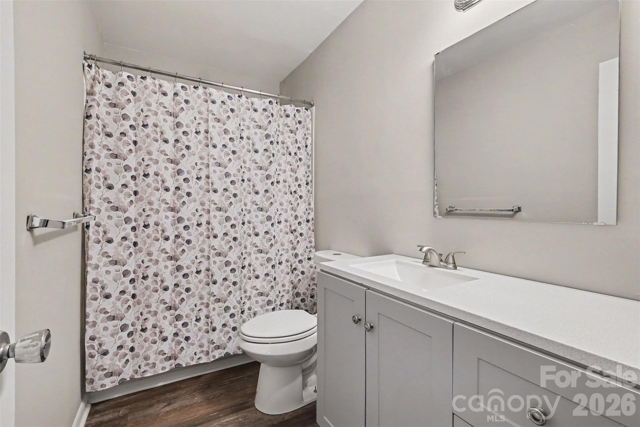RENOVATED BATHROOM WITH NEW VANITY, TOILET AND RESURAFCED BATHTUB - 3201 Heathstead Place, Charlotte