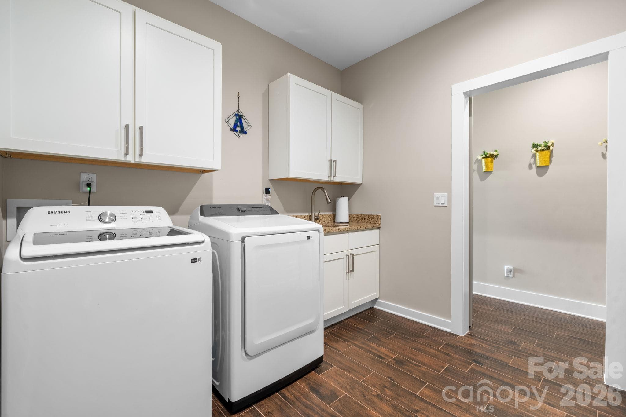 Sink and cabinetry in laundry - 3353 Rock Creek Road, Morganton