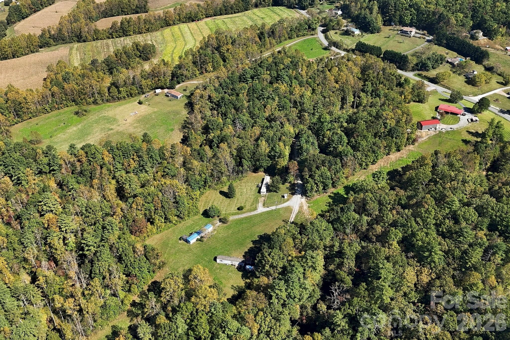 A unique combination of open, usable land and mature woodland creates opportunities for a variety of future uses, subject to applicable approvals. - 631 Union Hill Road, Hendersonville