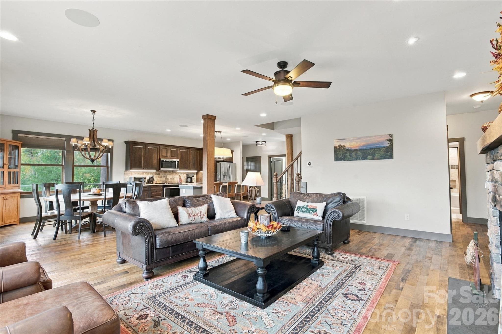 Open concept living with view into the dining/kitchen area - 1206 River Stone Drive, Laurel Springs