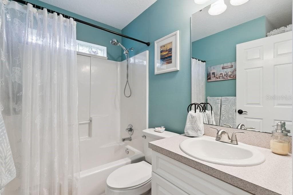 Secondary bathroom with linen closet - 30749 GLENN DR, TAVARES