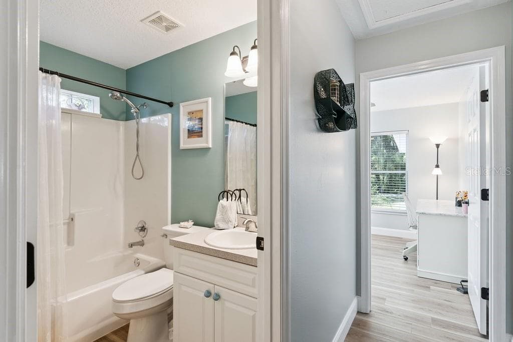 Secondary bathroom and bedroom 2 view from hallway - 30749 GLENN DR, TAVARES