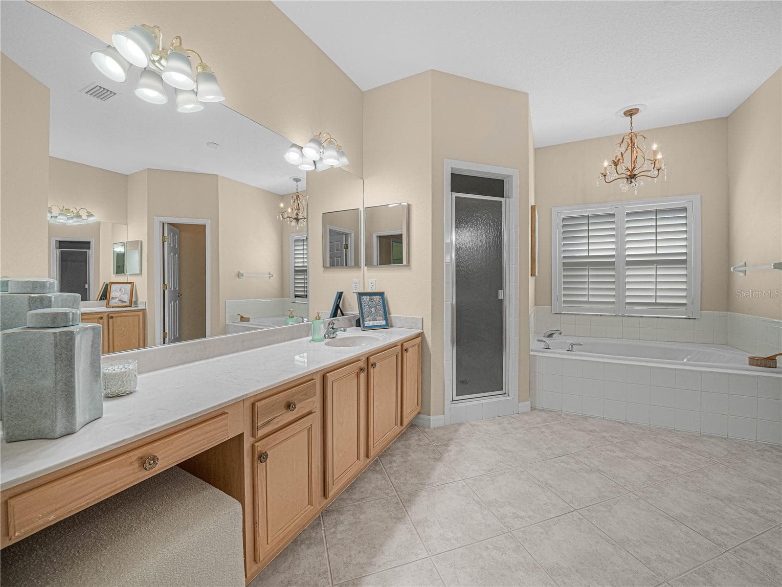 Primary Bath with His/Her Vanity. Makeup Seat - 4299 ASHTON CLUB DR, LAKE WALES