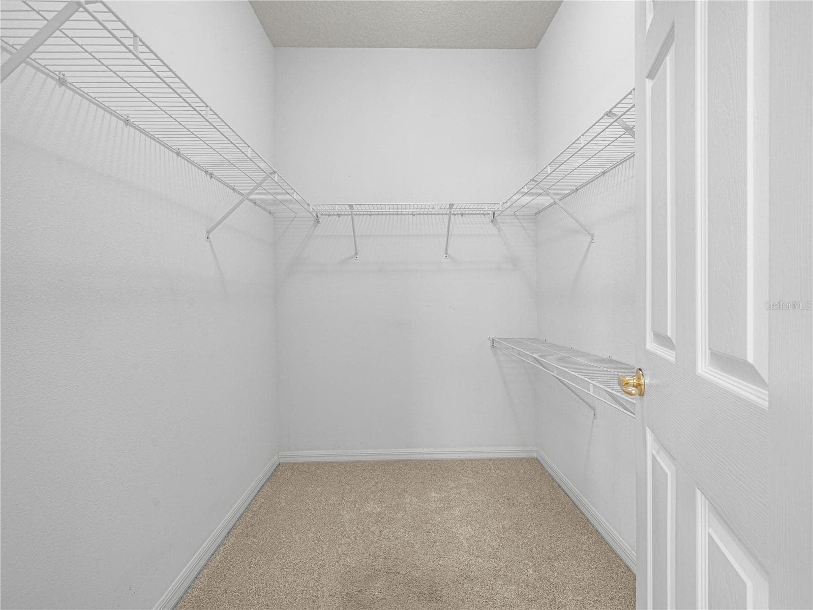 His/Her Walk In Closet in Primary Suite - 4299 ASHTON CLUB DR, LAKE WALES