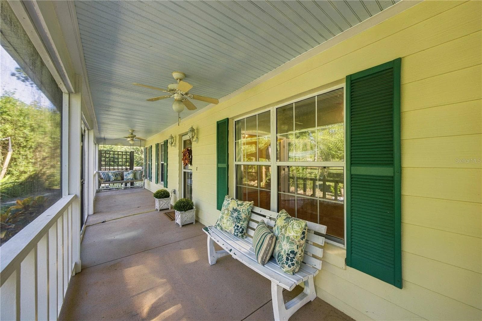 Screened porch on front of house - 7156 NW 11TH ST, OCALA