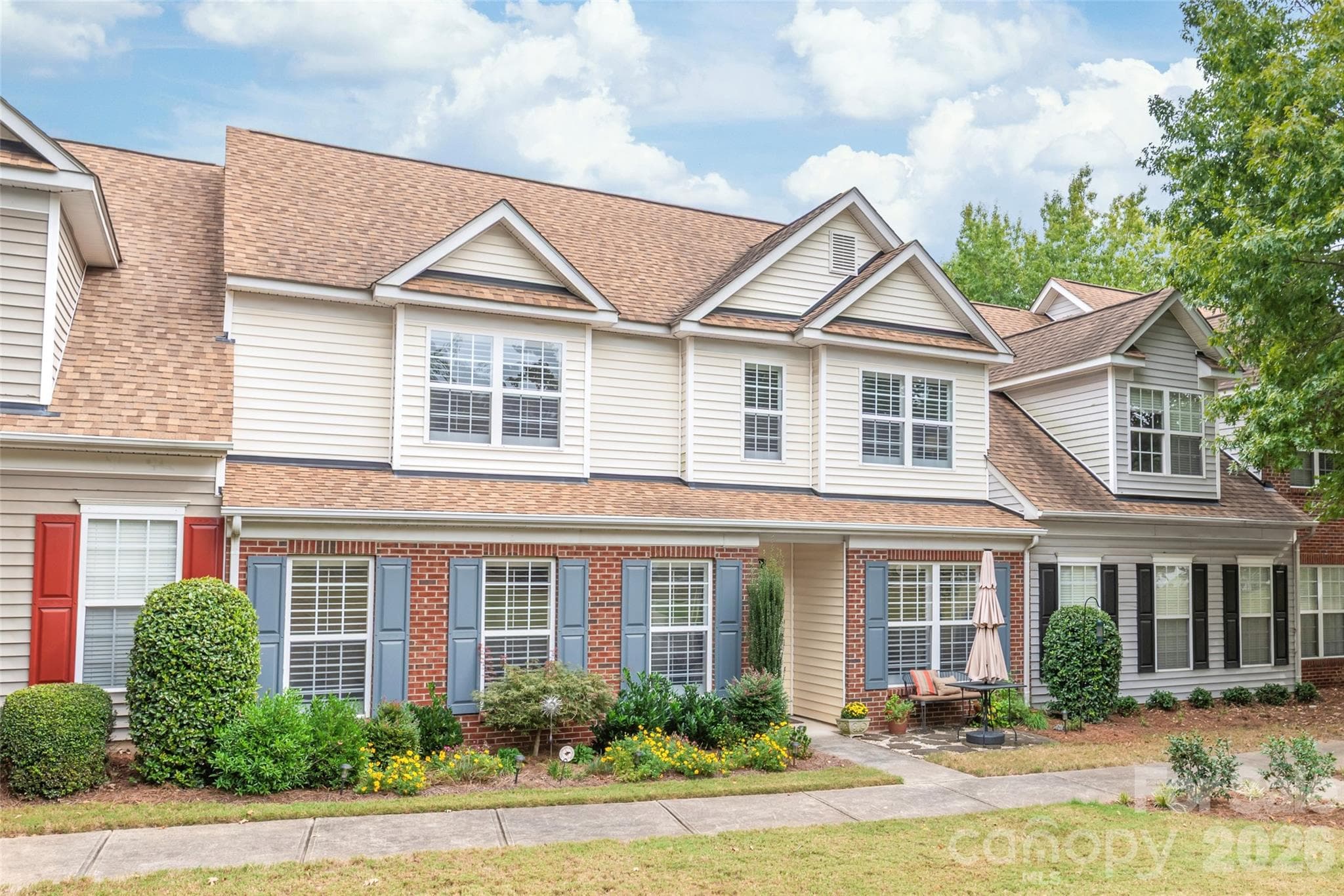 Upgraded Front Landscaping: Custom landscaping featuring a Japanese Maple tree. - 4780 Grier Farm Lane, Charlotte